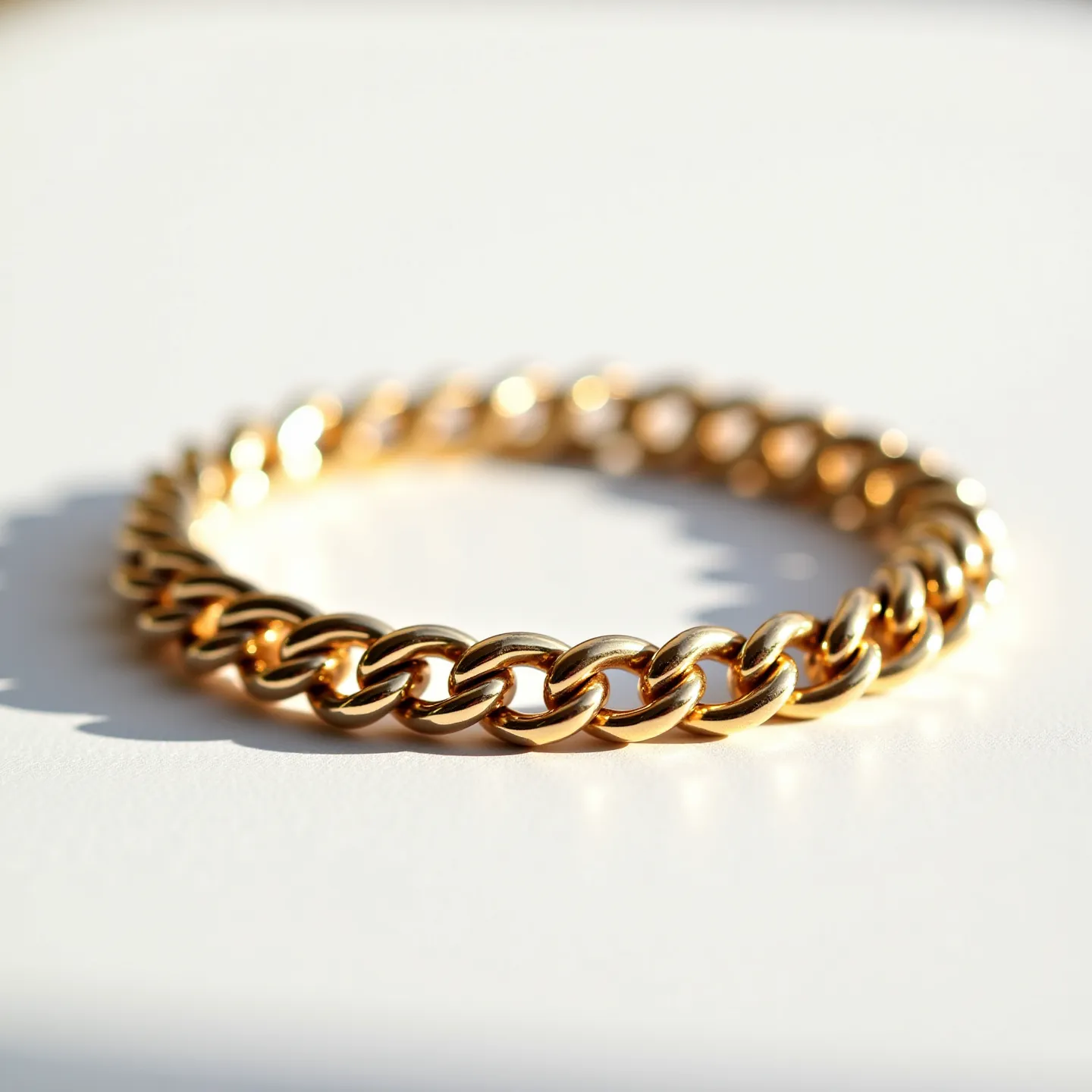 This Cuban link bracelet is crafted from polished gold, showcasing a series of interlocking, rounded links that create a seamless, fluid design. The lustrous gold surface reflects light, enhancing its elegant and luxurious appearance. The bracelet exhibits the traditional Cuban link style, known for its durability and timeless aesthetic. There are no visible gems or stones set into the bracelet, maintaining a clean and classic look. An integrated clasp mechanism ensures a secure fit while maintaining the bracelet's smooth and cohesive design.