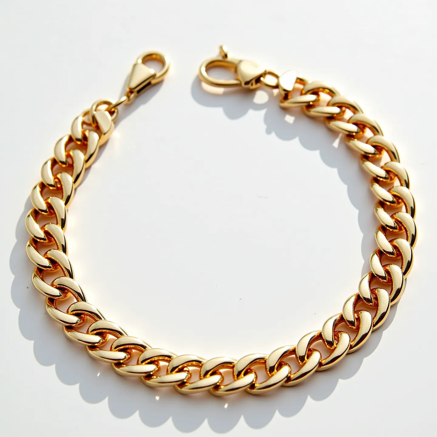 This cuban link bracelet features polished, interlocking links made of a shiny, gold-colored metal. It is equipped with a lobster clasp for secure attachment and ease of use. The bracelet lacks any additional embellishments or gemstones, presenting a clean and elegant design that highlights the craftsmanship of the metalwork.