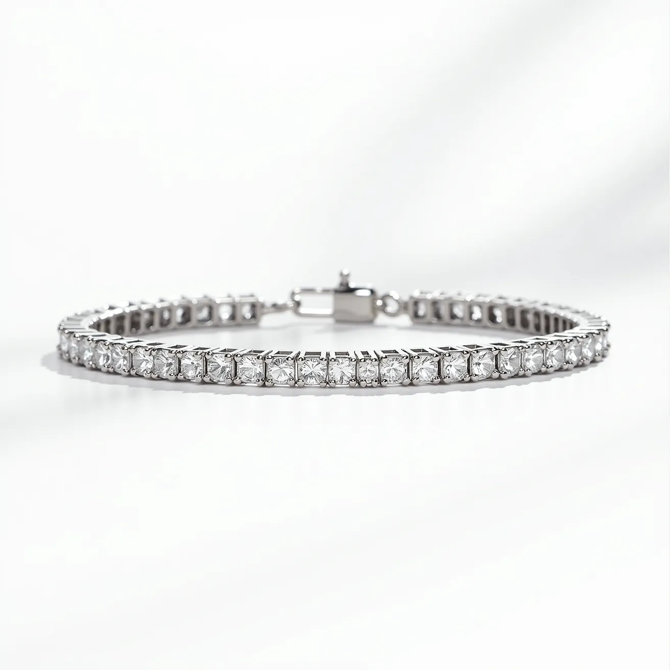 This diamond tennis bracelet features a row of evenly spaced, meticulously cut diamonds set in a sleek, lustrous metal band, likely white gold or platinum. Each diamond appears to be in a prong setting, allowing maximum light to enter and enhance their brilliance. The bracelet is secured with a box clasp that includes additional safety latches, ensuring a secure fit when worn. The design is elegant and timeless, exuding sophistication and sparkling beauty.