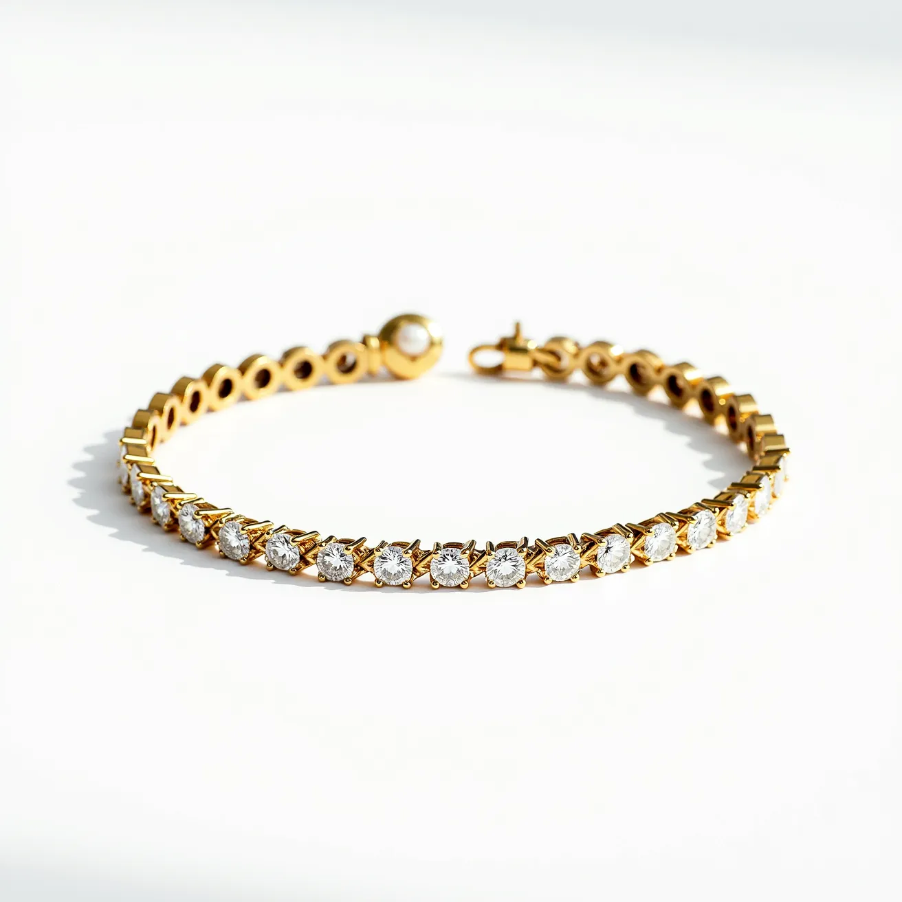 This diamond tennis bracelet features a series of round-cut diamonds set in a continuous line along a gold band, showcasing a dainty and elegant design. Each diamond is securely held in place by four prong settings, allowing maximum light to pass through and enhance their brilliance. The gold used in the bracelet adds a warm and luxurious contrast to the sparkling diamonds. At the end of the bracelet, there is a sturdy clasp mechanism that ensures a secure fit around the wrist.