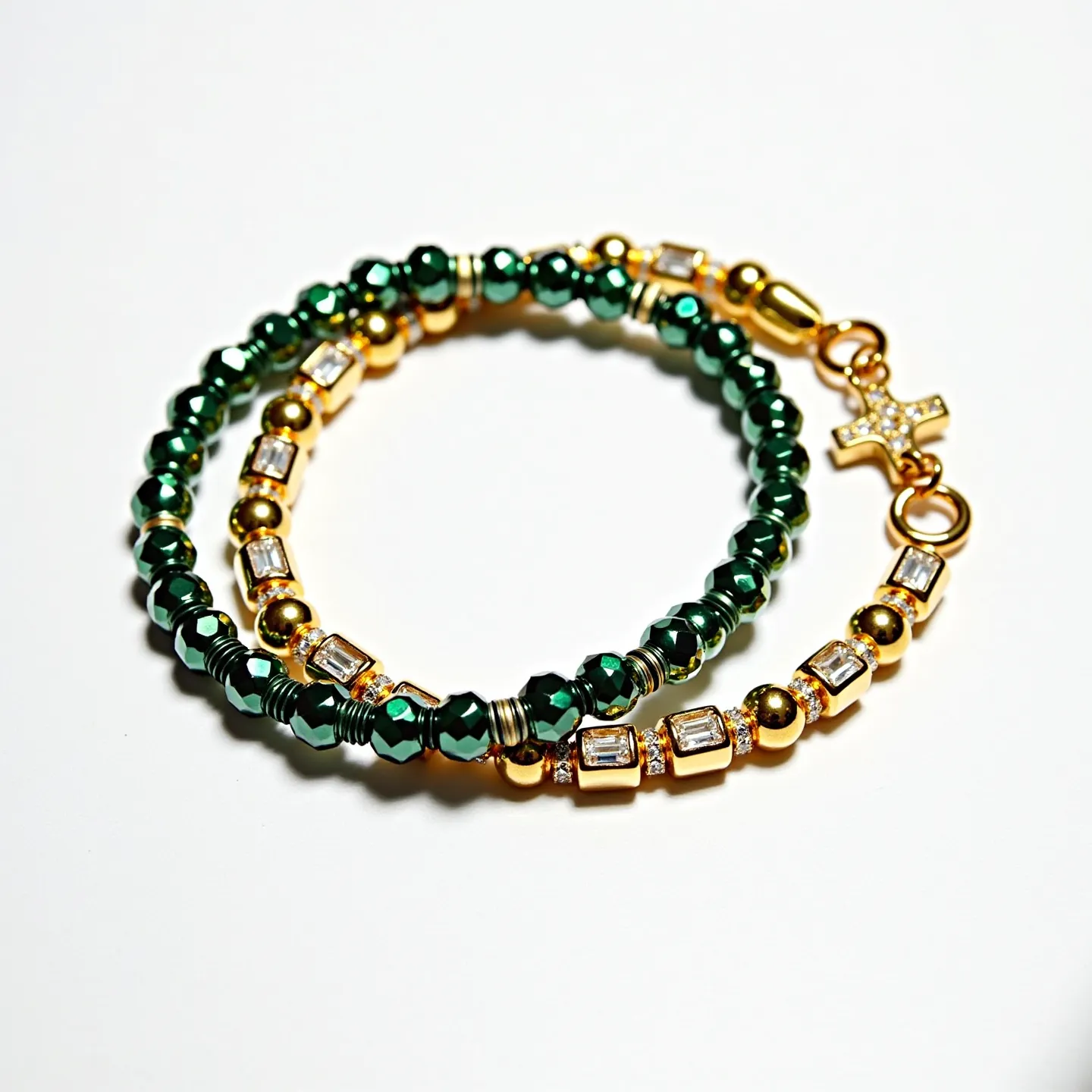 This gold beaded bracelet features an elegant combination of materials, prominently including gold-toned beads and faceted green beads. Interspersed among the gold and green beads are rectangular clear gemstones, set in a way that maximizes their brilliance and adds a refined touch of sparkle. The bracelet also showcases a small, encrusted cross charm as a decorative element, enhancing its overall aesthetic. The clasp mechanism appears to be a secure lobster clasp, ensuring both functionality and style.