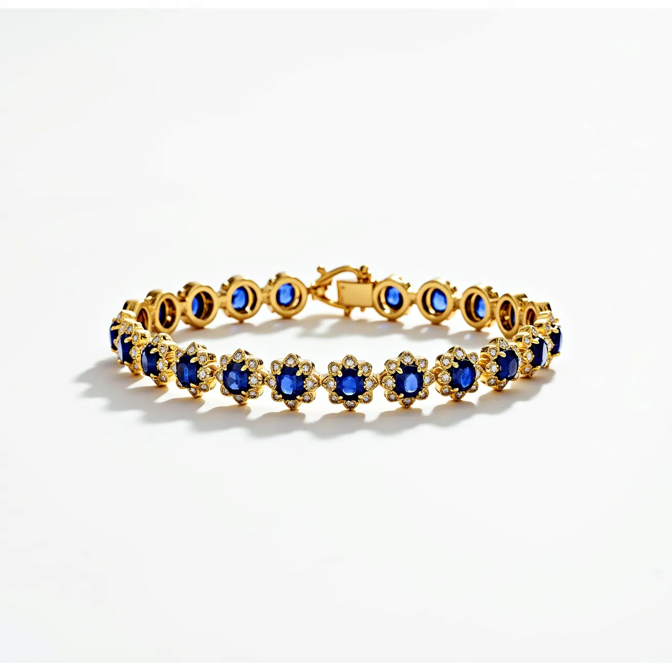 This gold tennis bracelet features a series of vibrant blue gemstones, each of which appears to be cut into an oval shape and is surrounded by a halo of smaller, clear stones. The main blue stones are set within gold prongs, enhancing their visibility and brilliance. The alternating pattern of blue and clear stones gives the bracelet a harmonious and elegant appearance. The clasp is designed as a sturdy box clasp, ensuring security while wearing the piece. The overall design showcases intricate craftsmanship and luxurious materials, making it a striking accessory.