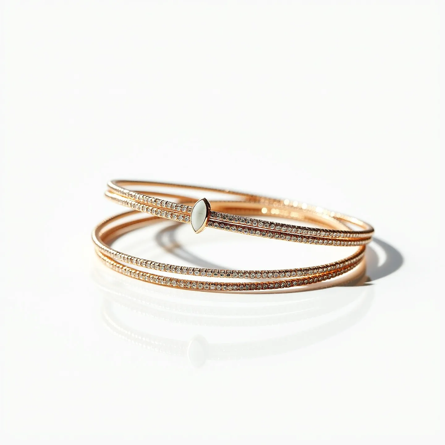 This matching bracelets feature slim, elegant bands crafted from a rose gold material that exudes a sophisticated and modern aesthetic. Each bracelet is adorned with a row of small, round-cut diamonds meticulously set in a pavé style along the length of the band, showcasing an exquisite sparkle. The central focus is a marquise-shaped mother-of-pearl gemstone, bezel-set just off-center on one of the bracelets, adding a touch of classic elegance. There is no visible clasp, suggesting an easy slip-on design that complements the sleek, continuous form of the bracelets.