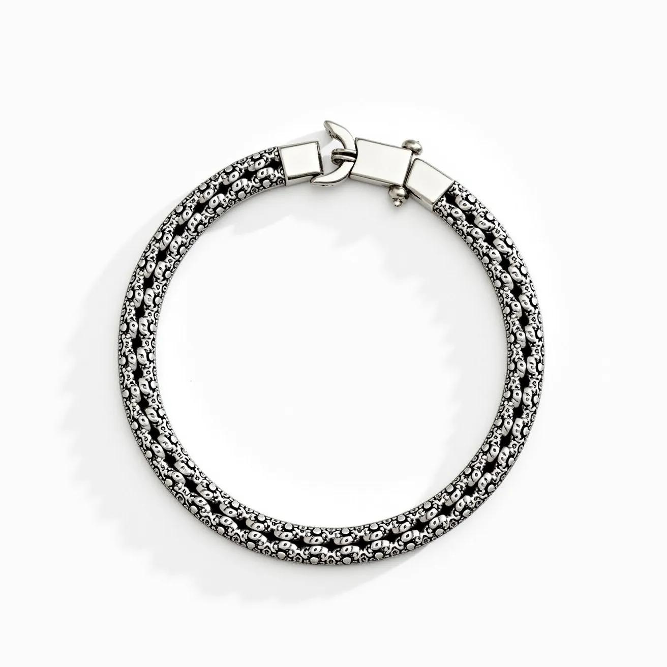 This men's bracelet showcases an intricately designed chain, crafted from what appears to be a series of durable, linked metal beads. The beads exhibit a pattern that gives the piece a textured and visually appealing aesthetic. The bracelet is adorned with monochromatic tones, predominantly featuring black and silver colors, adding to its sophisticated look. It is secured with a sleek, polished clasp that ensures a secure fit.