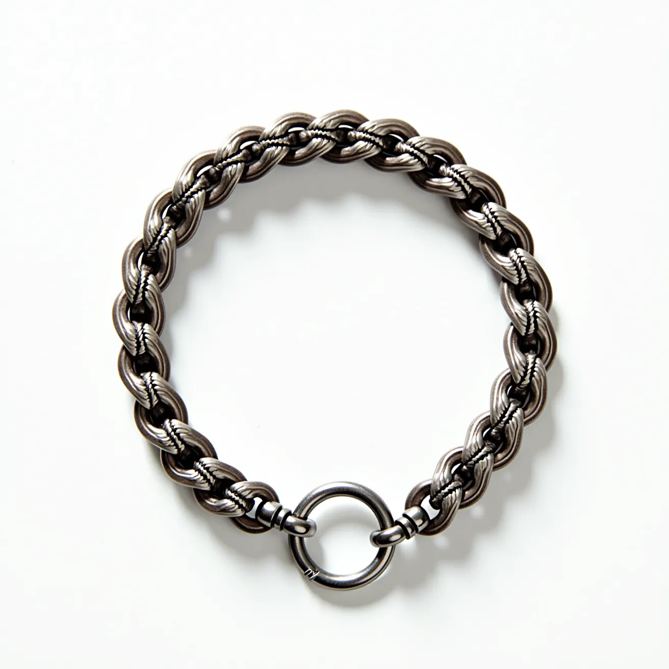 This men's bracelet features a robust design crafted from intricately woven metal links, providing a rugged yet polished appearance. The interlinked structure comprises thick rings, each with a textured finish that adds depth and visual interest to the piece. The bracelet is secured with a strong circular clasp, ensuring it stays firmly in place when worn. The high-quality metal used in the bracelet is likely stainless steel or another durable alloy, lending the piece longevity and resistance to wear. The clasp itself operates with a simple and effective mechanism that complements the bracelet's overall sturdy aesthetic.