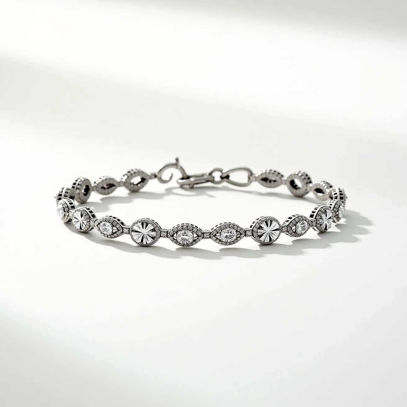 This moissanite tennis bracelet features a series of round and marquise-cut moissanite gemstones, each securely set in individual bezel settings. The stones are elegantly arranged in a repeating pattern, creating a continuous line of brilliance. The bracelet is crafted from a high-polish metal that accents the sparkle of the moissanite gems, adding to the overall luster. It is fastened with a secure hook-and-eye clasp, ensuring it remains comfortably on the wrist. The detailed design and secure setting make this piece both beautiful and durable, perfect for both everyday wear and special occasions.