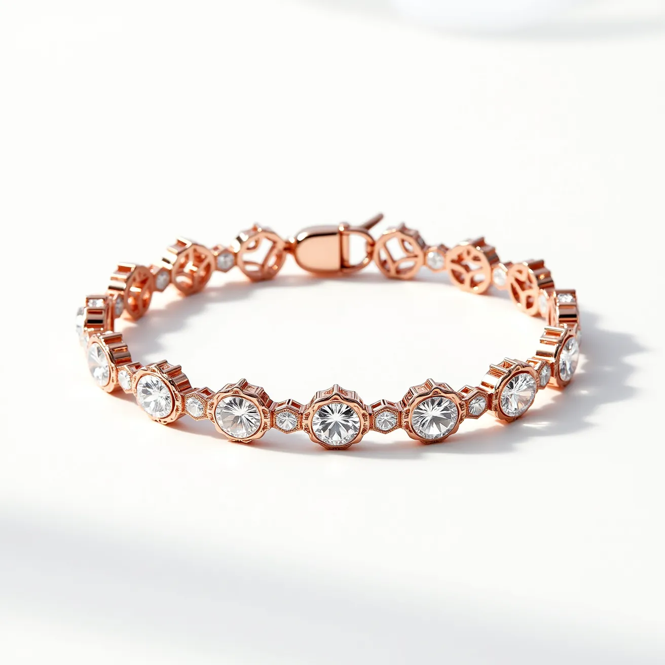 This moissanite tennis bracelet features a series of circular moissanite gemstones, each set in a rose gold-toned bezel setting that highlights the brilliance of the stones. The moissanites are round cut, enhancing their sparkle and clarity. Between the larger stones, smaller round moissanites are set in square frame settings, adding additional shimmer to the overall design. The bracelet is secured with a box clasp, ensuring a seamless and secure closure. The combination of the radiant moissanite gems with the warm rose gold metal creates an elegant and sophisticated piece of jewelry.