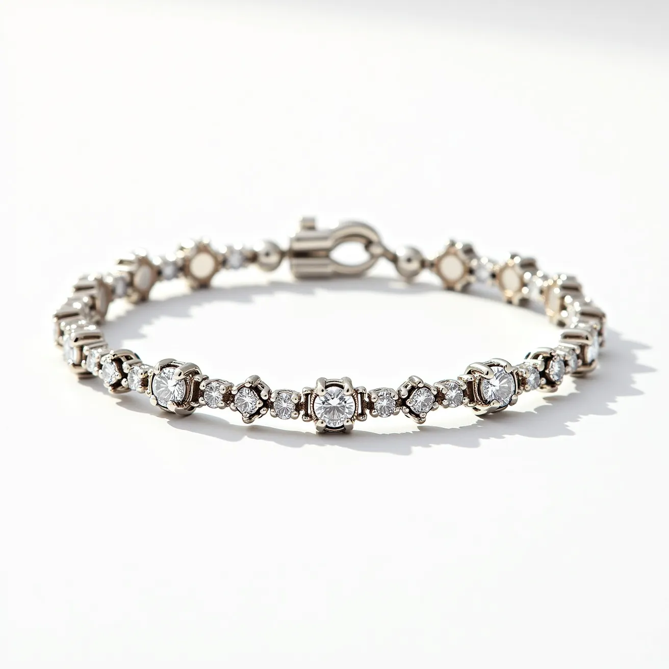 This moissanite tennis bracelet features a series of round-cut moissanite stones, each meticulously set within a four-prong setting. The bracelet is crafted from a metal material, likely white gold or platinum, which complements the sparkling moissanites. The secure clasp, typical of tennis bracelets, ensures the bracelet stays fastened while worn, blending seamlessly with the elegant design of the piece. The arrangement of the stones, along with the precise cuts, maximizes their brilliance and fire, making this bracelet a truly stunning accessory.