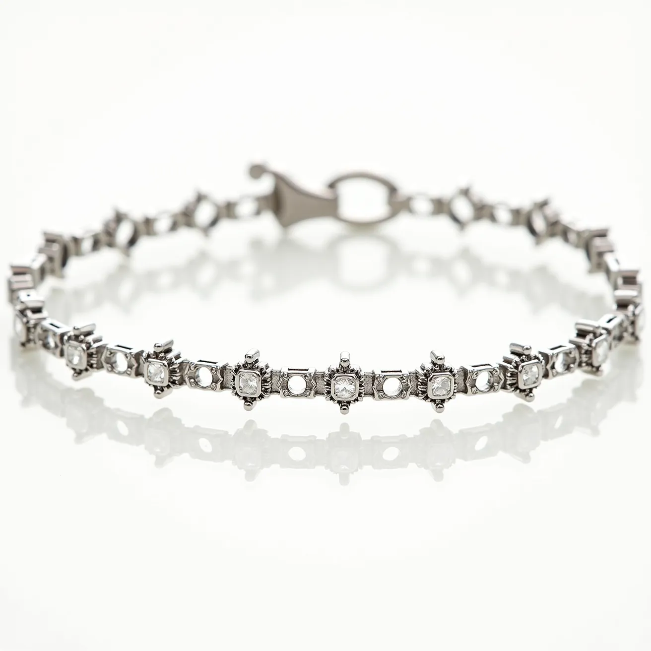 This moissanite tennis bracelet features a series of moissanite gems, each meticulously cut into a square shape and secured by an elegant prong setting that accentuates their brilliance. The bracelet is crafted from a high-quality metal, likely white gold or platinum, which provides a sleek and polished finish to complement the sparkle of the moissanites. The prong settings ensure the stones are held securely in place while allowing maximum light to pass through, enhancing their natural shimmer. The bracelet is fastened with a sturdy, sophisticated clasp that matches the overall design, ensuring both security and style are seamlessly integrated into this exquisite piece of jewelry.