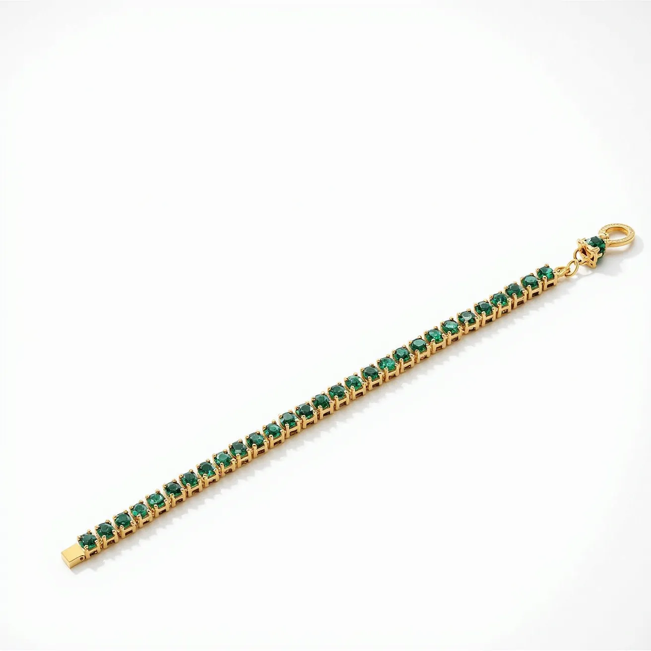 This tennis bracelet features a row of green gemstones, each cut into a round shape and securely held in place by a prong setting. The stones are uniformly aligned, creating a continuous, elegant line along the bracelet's length. The base material appears to be a polished yellow gold, which complements the vibrant green of the stones. The bracelet is equipped with a round clasp for secure attachment, providing both functionality and style to the piece.