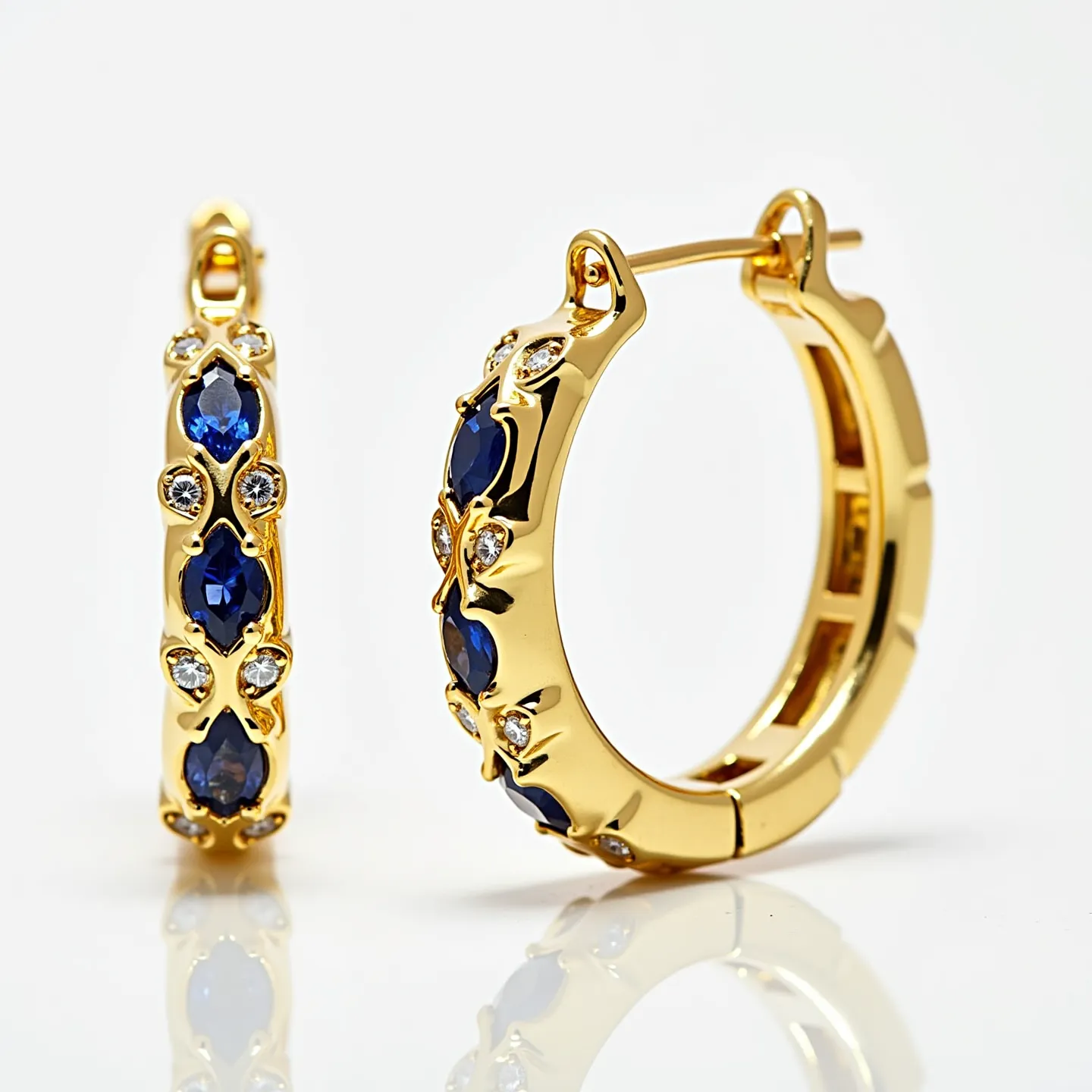 These cartilage hoop earrings feature an elegant design crafted from a gold metal base, showcasing a combination of deep blue sapphires and sparkling diamonds. The sapphires are cut in a marquise shape, set securely within prong settings, enhancing their vibrant hue and brilliance. Interspersed among them, small round-cut diamonds are set in similar settings, creating a captivating sparkle that complements the richness of the sapphires. The earrings offer a hinged snap clasp mechanism, providing both ease of wear and security. This exquisite combination of materials and craftsmanship embodies a timeless allure.