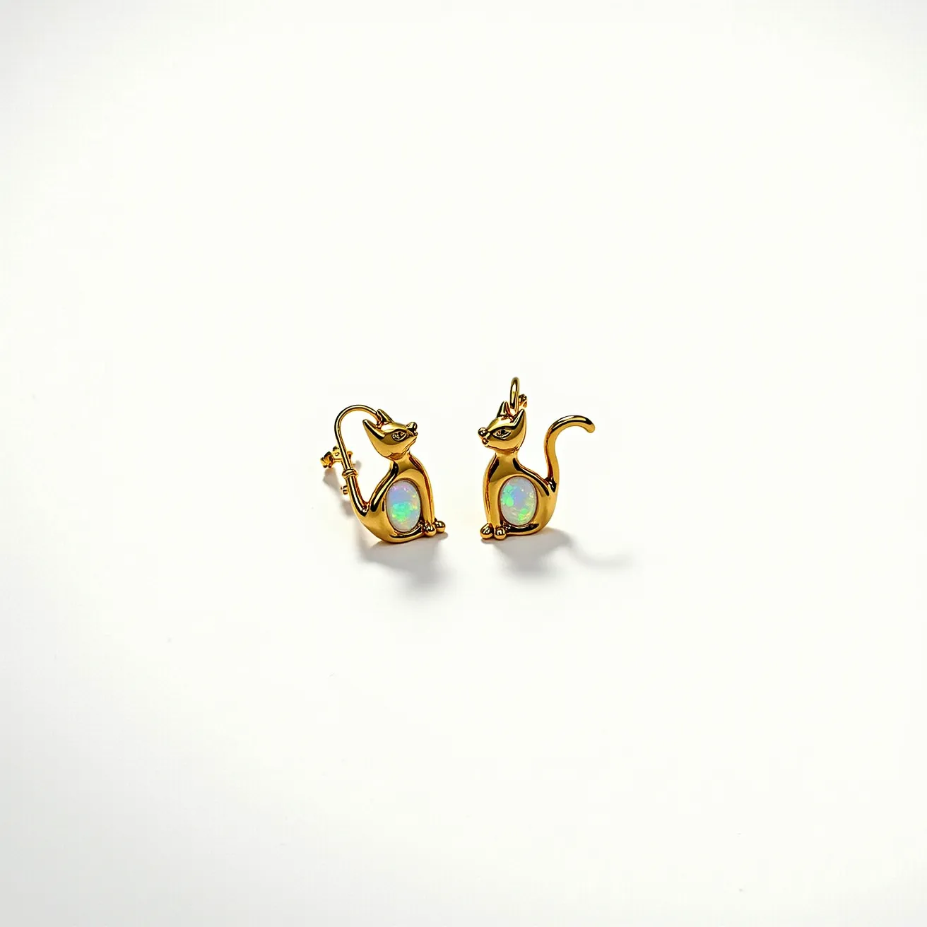 These cat earrings feature a charming design crafted from a shiny gold-toned metal, shaped into the silhouette of sitting cats. At the center of each earring is an oval opal, exhibiting a play of colors typical of this gemstone. The opal is cabochon cut and securely set within the body of the cat, adding a vibrant focal point to the piece. These earrings are equipped with a simple post back, providing a secure and easy attachment. The combination of the gold hue and the colorful opals creates an elegant and whimsical accessory.