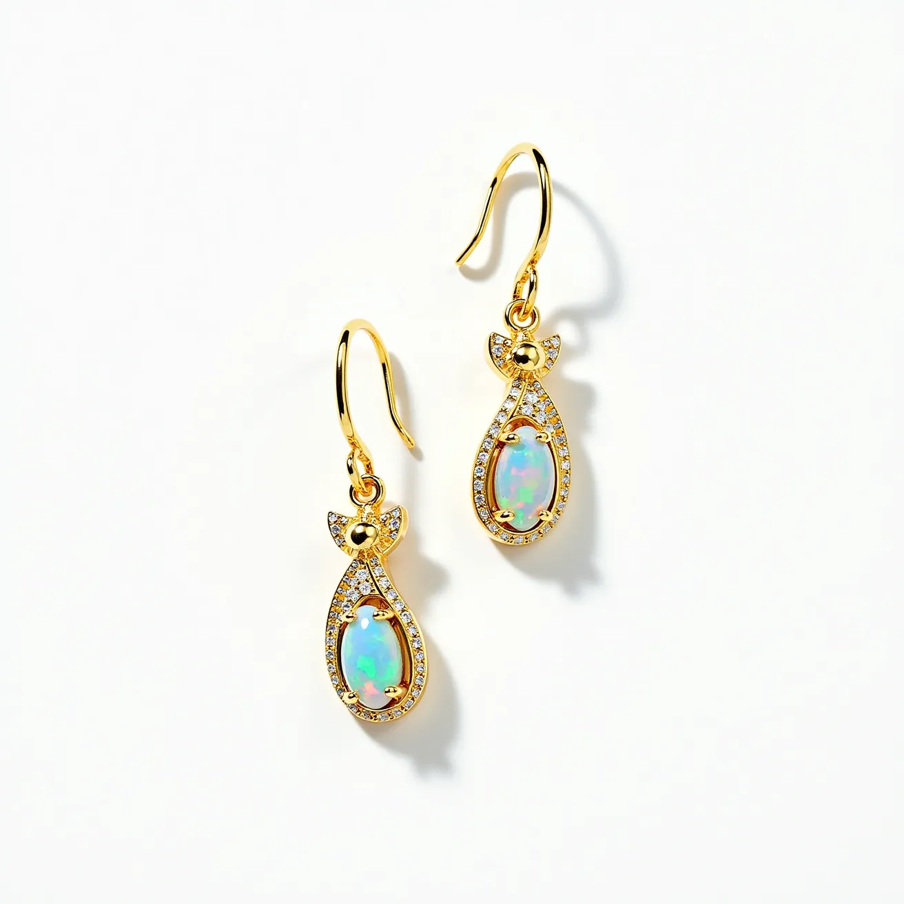 These cat earrings feature a gold-toned metal shaped into a stylized cat form, with a beautifully opalescent central gem that appears to be an opal, set in an open bezel setting. Surrounding the opal are small, clear stones that resemble diamonds, set in a pavé style, enhancing the sparkle and elegance of the piece. A hook clasp allows for easy and secure attachment to the ear, offering both functionality and style. These earrings beautifully balance whimsical design with refined materials, making them a striking accessory.