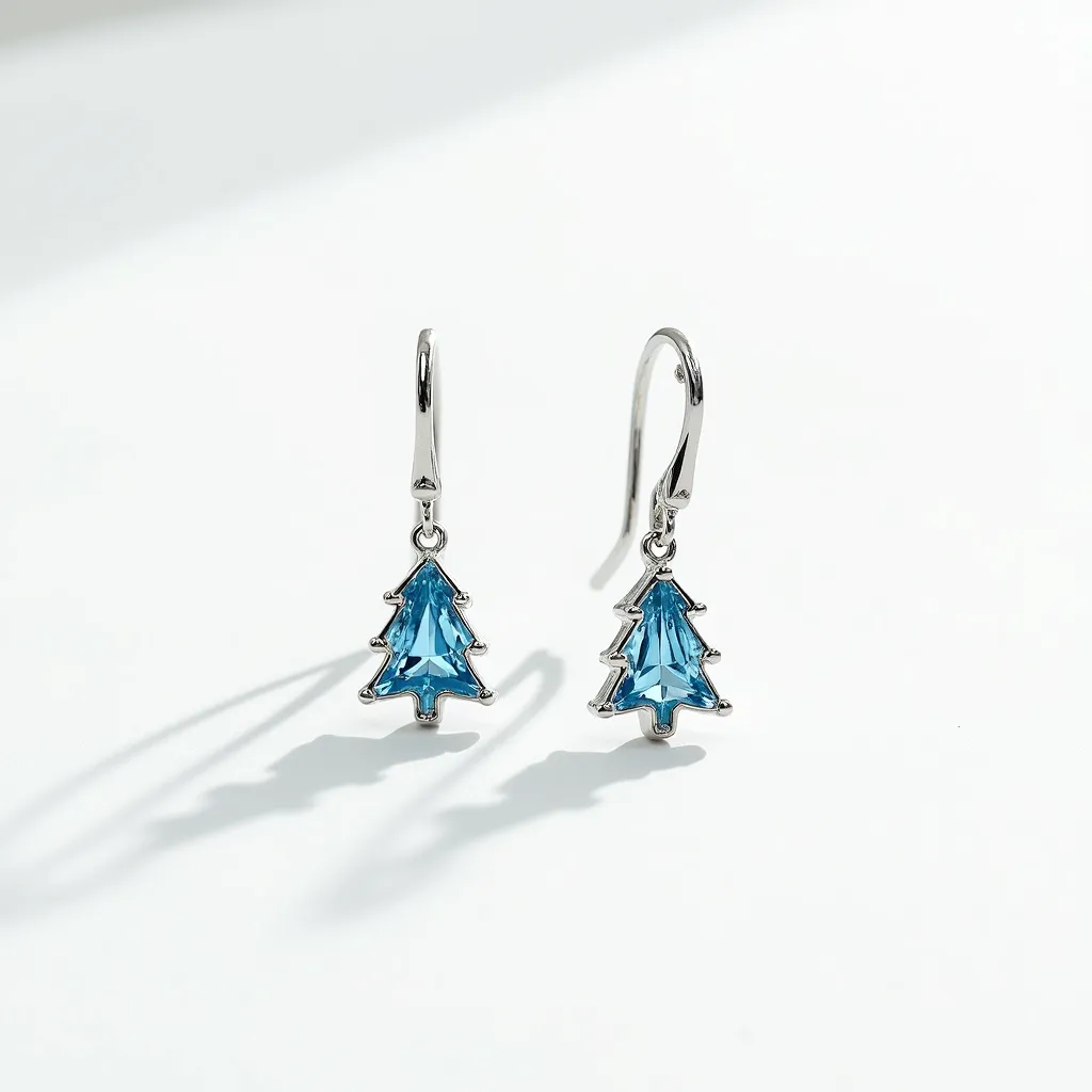 These christmas earrings feature a charming design of Christmas tree motifs made from silver metal. Each earring is adorned with a blue gemstone, intricately cut into a triangle shape to mimic the silhouette of a festive tree. The gemstones are set with prongs that securely hold them in place, enhancing the tree shape with their crisp edges. The earrings are equipped with sleek French hook clasps, ensuring a comfortable and secure fit for the wearer. The overall design combines elegance with a playful nod to the holiday season.