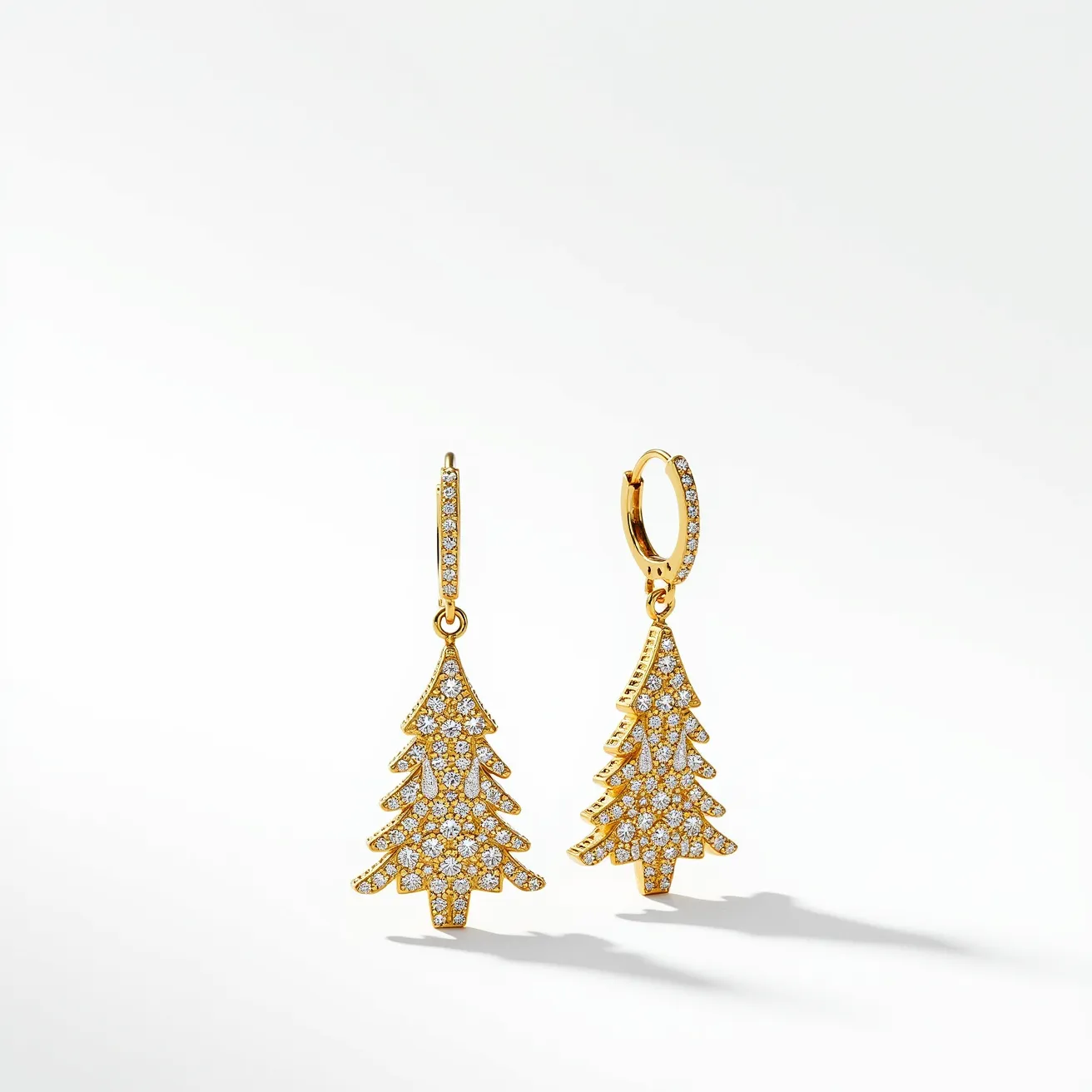 These Christmas earrings are elegantly designed in the shape of festive Christmas trees. They are crafted from a gold-toned metal, exuding a warm and luxurious aura. The earrings are intricately adorned with numerous small, sparkling gems, likely clear crystals or cubic zirconia. These gems are round-cut and pavé-set, providing a shimmering effect that enhances the holiday theme. The earrings feature a hinged hoop clasp, ensuring secure and comfortable wear. The meticulous placement of the gems and the smooth, polished finish of the metal both contribute to the overall sophisticated appearance of these holiday-themed accessories.