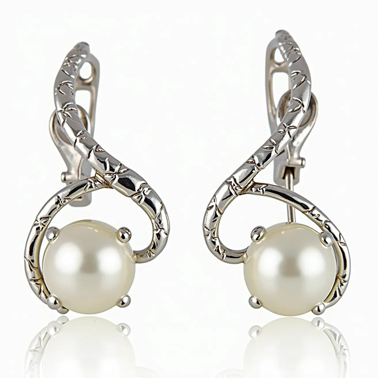 These clip on earrings feature an elegant design with a lustrous pearl as the centerpiece, held securely by a four-prong setting. The surrounding material appears to be silver-toned metal, intricately sculpted to form a stylish twist that adds texture and sophistication to the overall look. These earrings utilize a hinge clip mechanism, providing a secure and comfortable fit for non-pierced ears. The combination of the smooth pearl and the intricately detailed metal creates a timeless and versatile accessory.