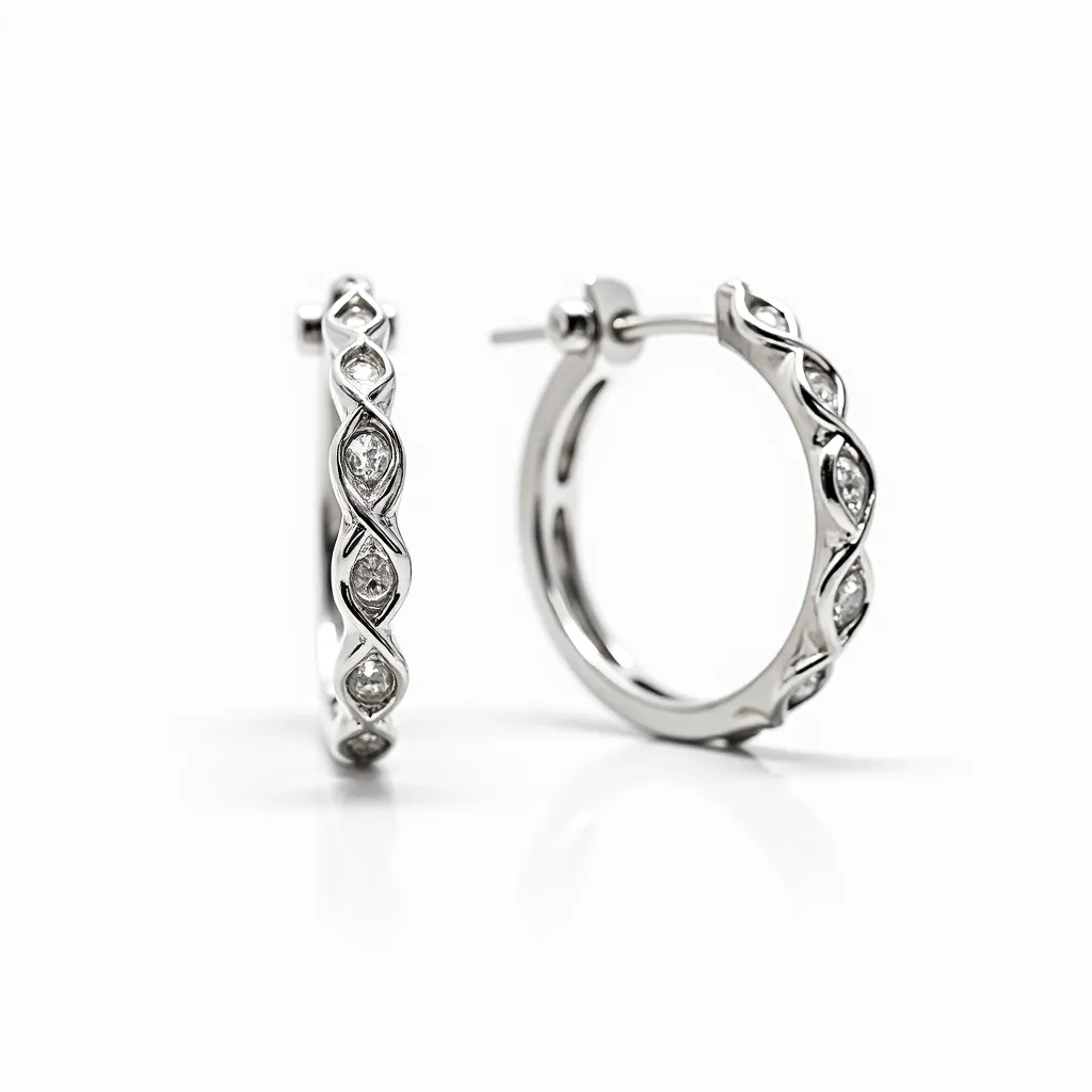 These diamond hoop earrings are crafted from a polished white metal, likely platinum or white gold, exhibiting a sleek and reflective surface. The hoops are adorned with round-cut diamonds intricately set in a twisted vine-like design, allowing each stone to be framed elegantly and securely within the metal bands. The diamonds are placed at regular intervals, enhancing the hoop’s luxurious and dynamic visual appeal. The attachment features a post-and-hinged back clasp, providing a secure and convenient method for wearing. The earrings’ design combines elegance with a touch of modern sophistication, making them suitable for a range of occasions.