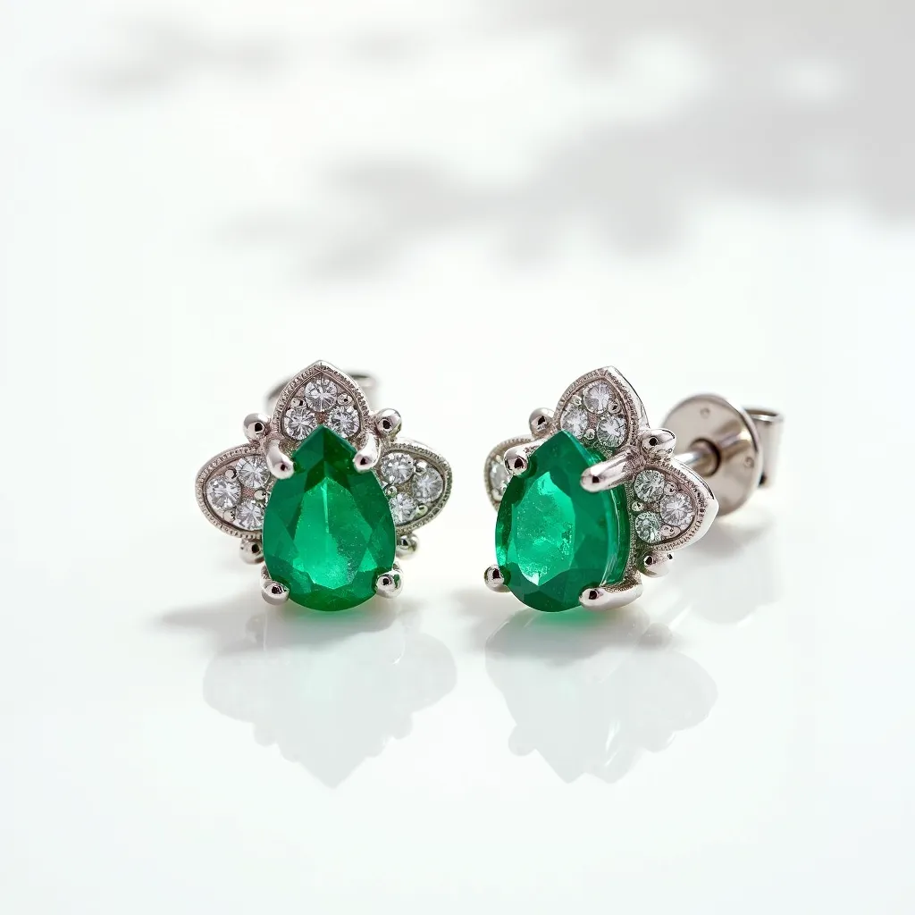 These emerald earrings feature a captivating design centered around pear-shaped emeralds, which are securely set with prongs, enhancing their vibrant green hue. Surrounding each emerald is an ornate halo of small, round-cut diamonds, which are set in a metal that appears to be white gold or platinum, providing an elegant contrast and additional sparkle. The earrings are secured with a classic screw-back closure, ensuring a stable fit on the ears. The combination of the lush emerald gemstones, the brilliance of the diamonds, and the refined metalwork highlights the craftsmanship of this exquisite piece.