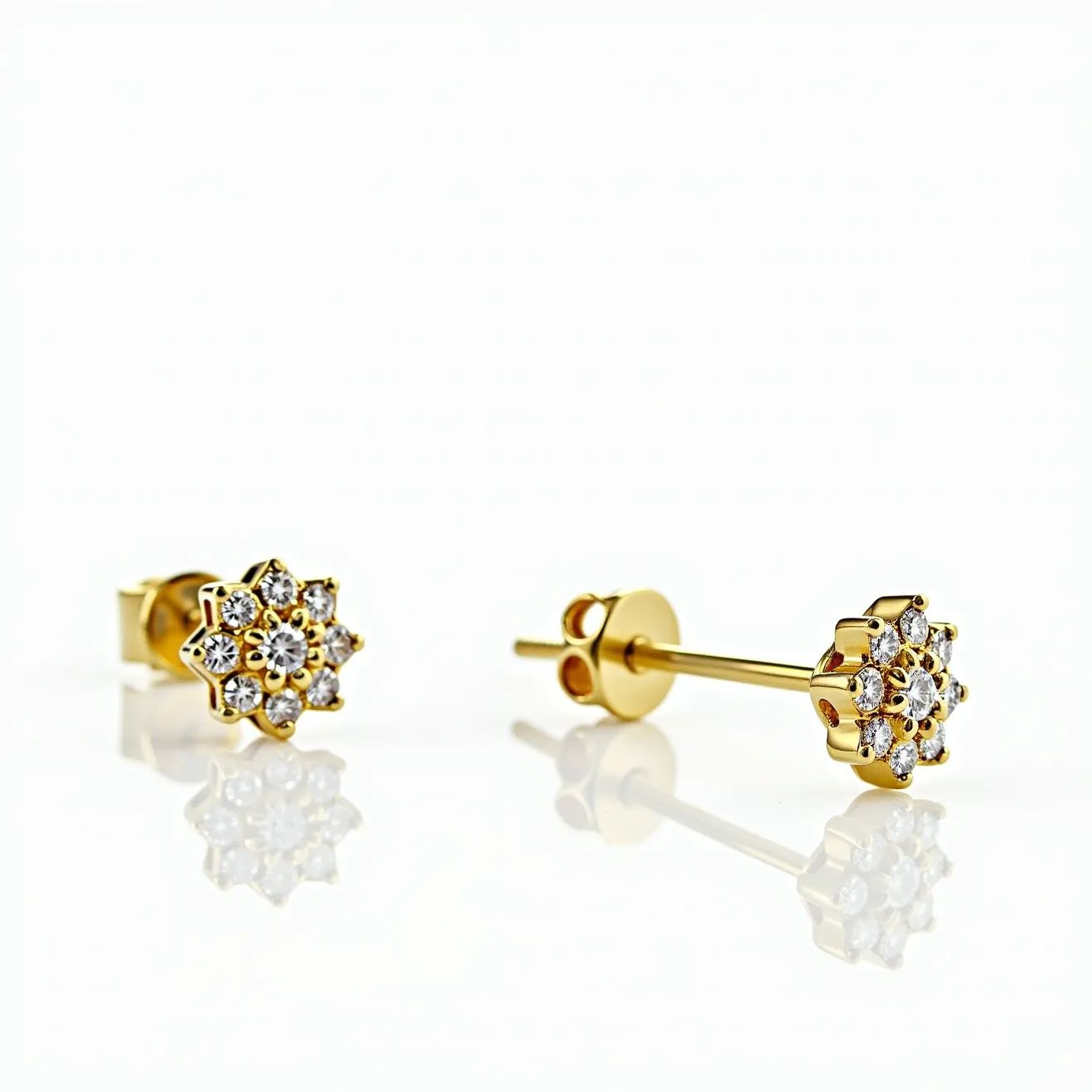 These gold cartilage earrings feature a delicate floral design, crafted from gold. Each earring is studded with several small, round-cut clear gemstones, likely diamonds or cubic zirconia, arranged symmetrically around a central stone of the same type and cut. The stones are set in a prong setting, which adds elegance and ensures the gems are securely held. The earrings use a straightforward post and butterfly clasp attachment, providing a secure fit for cartilage piercings. The refined arrangement and quality materials suggest a blend of sophistication and charm, ideal for both everyday wear and special occasions.