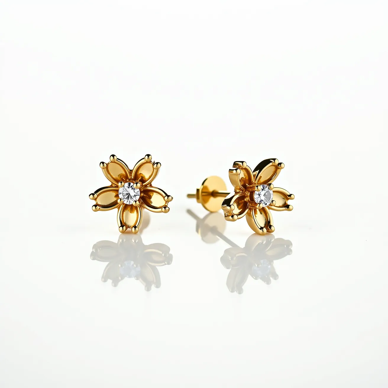 These gold cartilage earring features a floral design crafted from gold with a central gemstone. The gemstone is a round-cut, clear stone, set prominently at the center, likely using a prong setting that enhances its visibility and adds to the earrings' sparkle. The flower petals are stylized, appearing smooth and polished, contributing to a refined and elegant appearance. The earring is attached with a classic post and butterfly back clasp, ensuring a secure fit suitable for cartilage piercings.