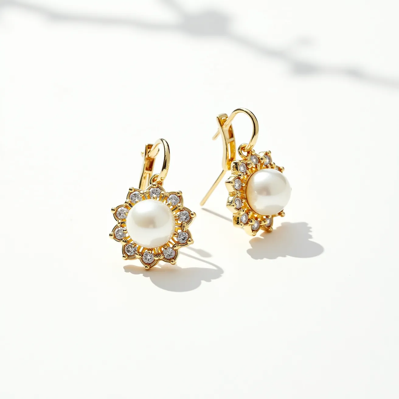 These gold earrings feature a classic and elegant design, crafted primarily from gold. At the center of each earring is a large, lustrous pearl, which serves as the focal point. Surrounding the pearl is a halo of small, round-cut diamonds, neatly set in prong settings that enhance their sparkle and brilliance. The earrings are attached with secure lever-back clasps, ensuring a comfortable and safe fit. The combination of gold, pearls, and diamonds creates a timeless and sophisticated appearance.