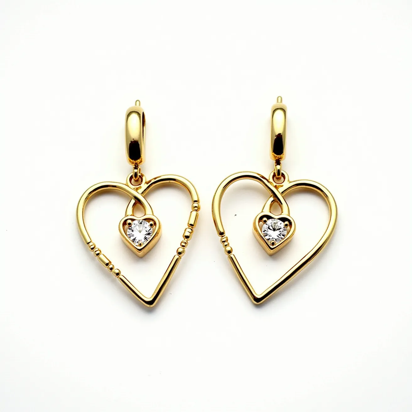 These gold heart earrings feature an elegant and open heart-shaped design crafted from gold, lending them a gleaming finish. At the center of each heart is a small, heart-shaped clear gem, likely a diamond or high-quality cubic zirconia, cut to enhance its brilliance and securely set in a simple bezel setting. The earrings are designed with a polished gold clasp that appears to connect seamlessly to the open heart, ensuring they hang elegantly and securely when worn. The intricate beading on parts of the heart adds a subtle texture, enhancing their sophisticated appearance.