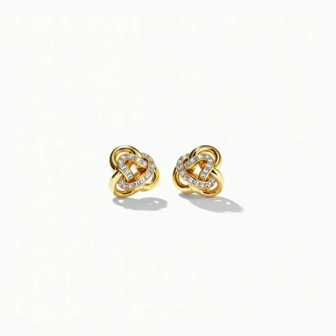 These gold knot earrings feature an intricate design crafted from polished gold. The central focal point of each earring showcases a series of small, round brilliant-cut diamonds set along the overlapping loops of the knot, creating a shimmering effect. The diamonds are securely held in a pavé setting, enhancing their sparkle. The earrings are designed with a stud fastening, which provides a secure and comfortable fit for pierced ears. The combination of gold and diamond accents offers a classic and elegant appearance.