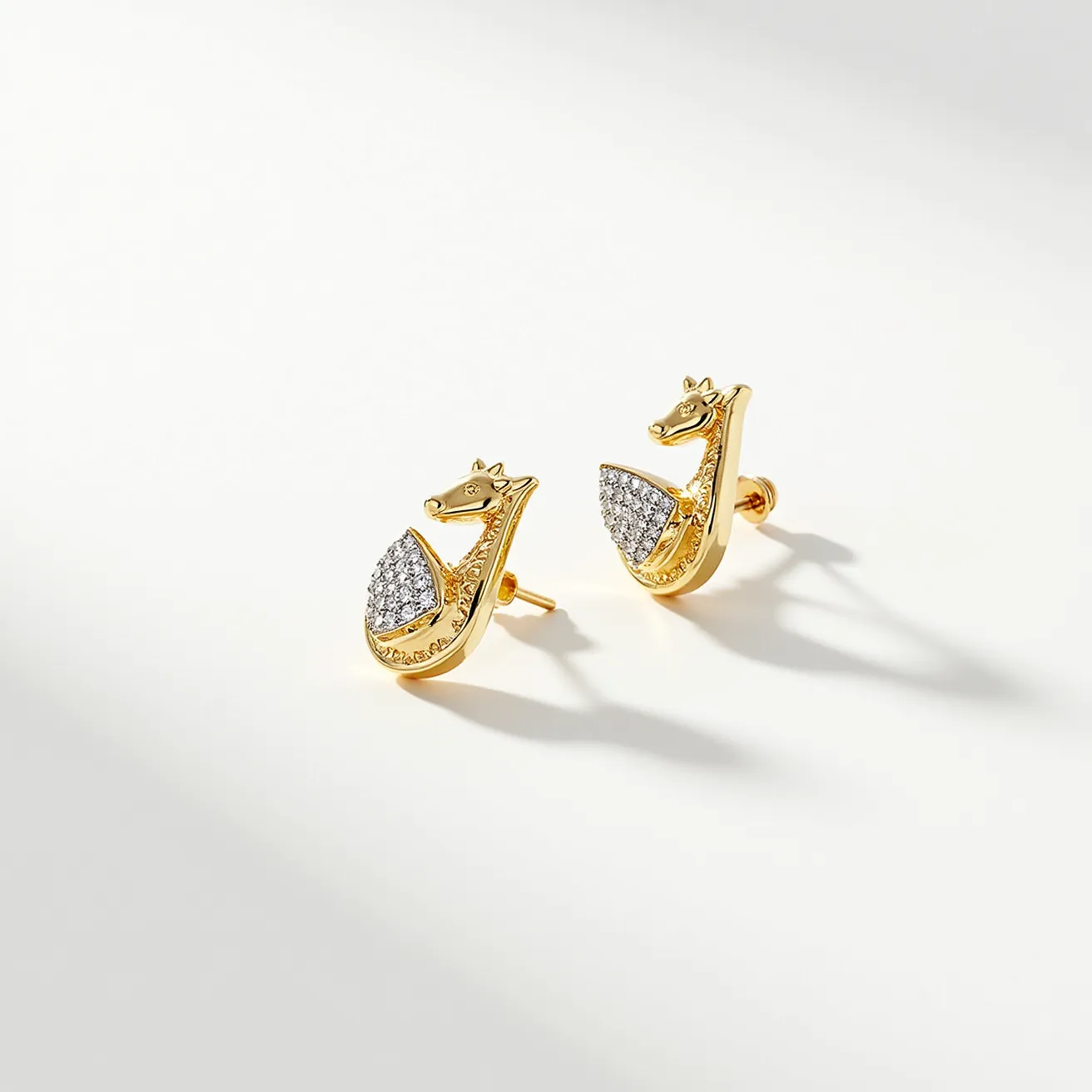 These gold stud earrings are crafted from a lustrous yellow gold material, intricately designed to resemble a stylized seahorse. They are embellished with numerous small, round-cut diamonds that are pave-set to form a shimmering section along the body of the seahorse, adding a sophisticated sparkle. The earrings feature a post backing, secured with a butterfly clasp, ensuring they stay comfortably in place when worn. The combination of gold and diamond detailing gives these earrings an elegant and luxurious appeal.