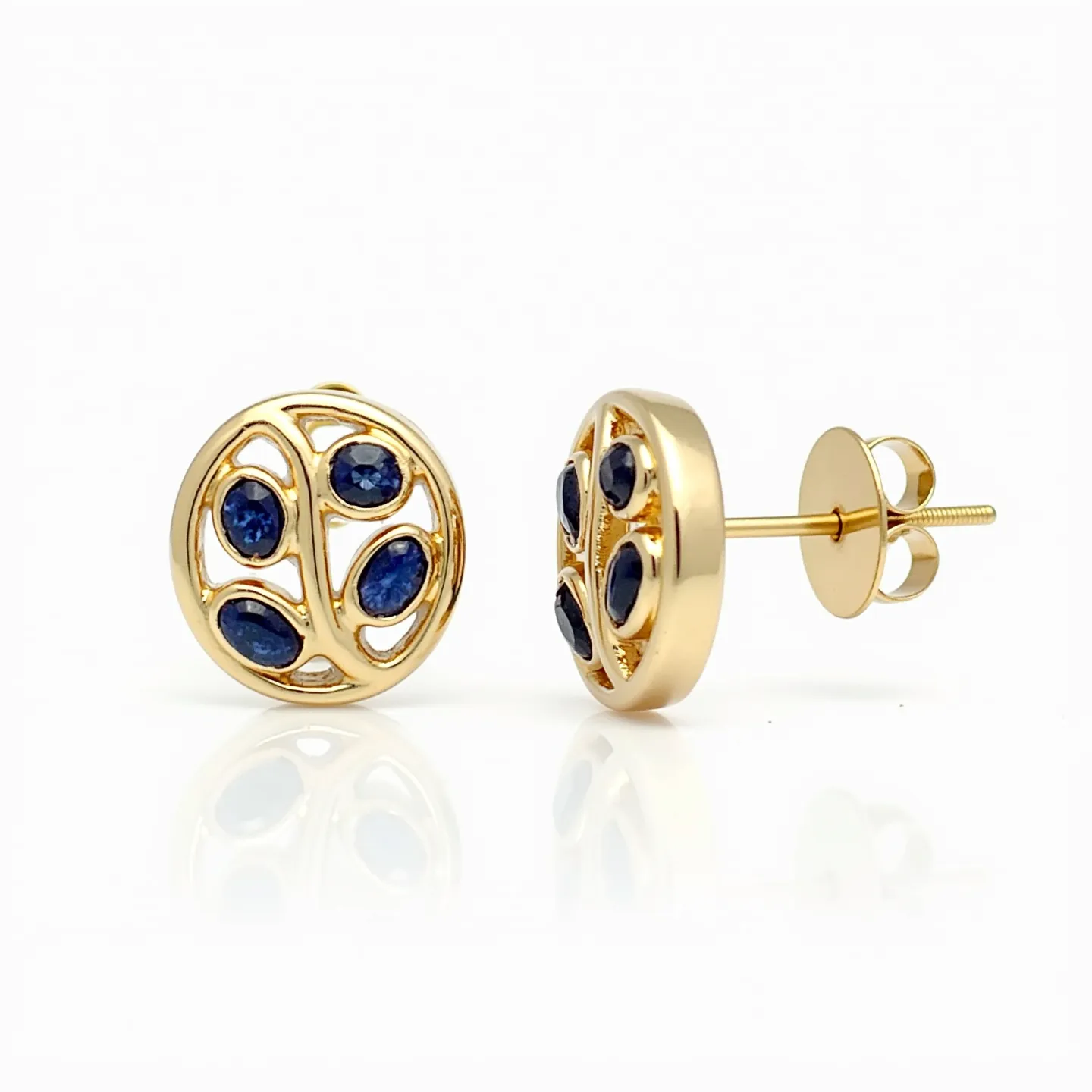 These gold stud earrings feature a circular design crafted from a polished yellow gold, showcasing a series of blue gemstones. The stones, likely sapphires, are oval in shape and set within the gold framework in a bezel setting that securely holds them in place. The earrings include a classic post with a screw-on back for attachment, ensuring a secure fit when worn. The combination of gold with deep blue gemstones creates an elegant and timeless aesthetic.