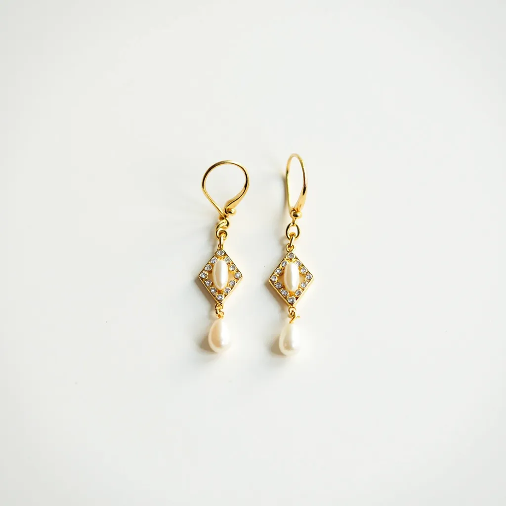 These hanging earrings feature a delicate design with an elegant gold framework. Each earring is adorned with a central pearl at the bottom, contributing a touch of classic sophistication. The gold framework is diamond-shaped, embellished with small, sparkling stones that are likely round-cut and pave-set, adding a subtle shine around the central elongated pearl, which is vertically oriented within the frame. The attachment is a lever-back clasp, ensuring secure wear while maintaining the earring's graceful dangle and movement.