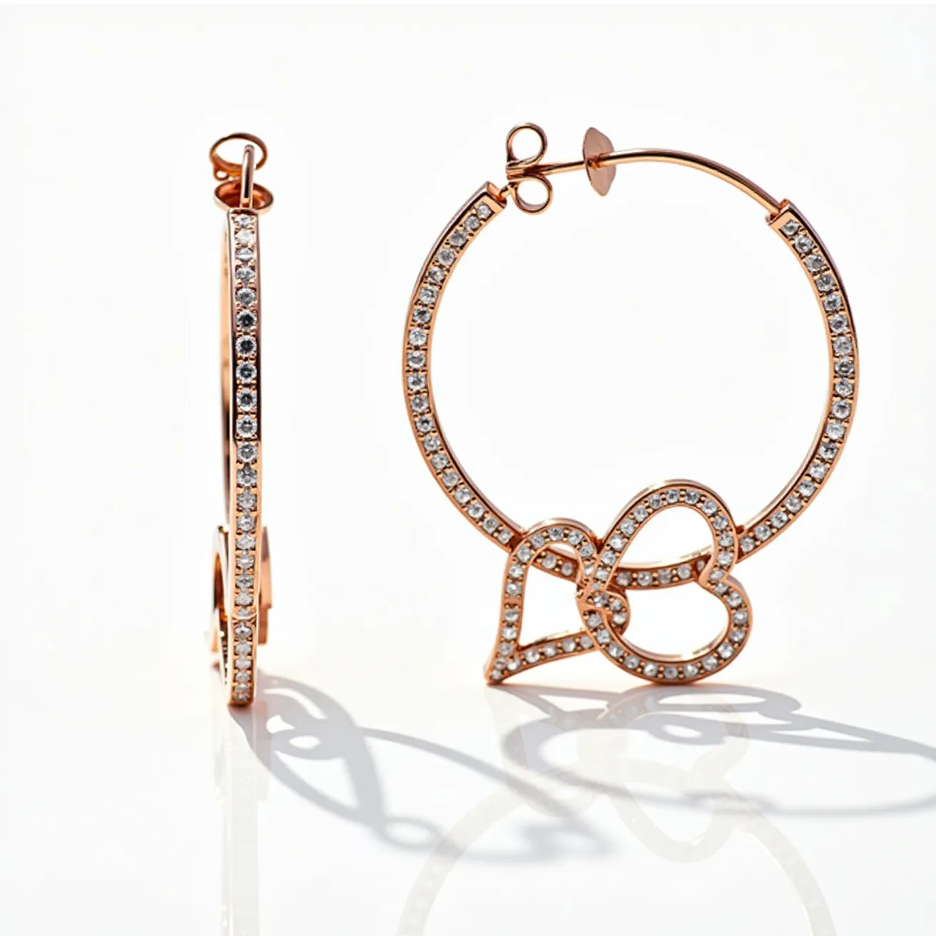 These hoop earrings feature a rose gold metal, which elegantly encircles numerous small, clear gemstones prominently set into the surface. The stones are likely cubic zirconia or diamonds, set in a pave setting that enhances their sparkle and brilliance. A distinct design element is the overlapping double heart motif integrated within the hoop, also embellished with matching stones, adding a romantic touch. The earrings are secured with a post and butterfly clasp, providing both stability and ease of use. The overall design blends modern elegance with a touch of sentimental charm.