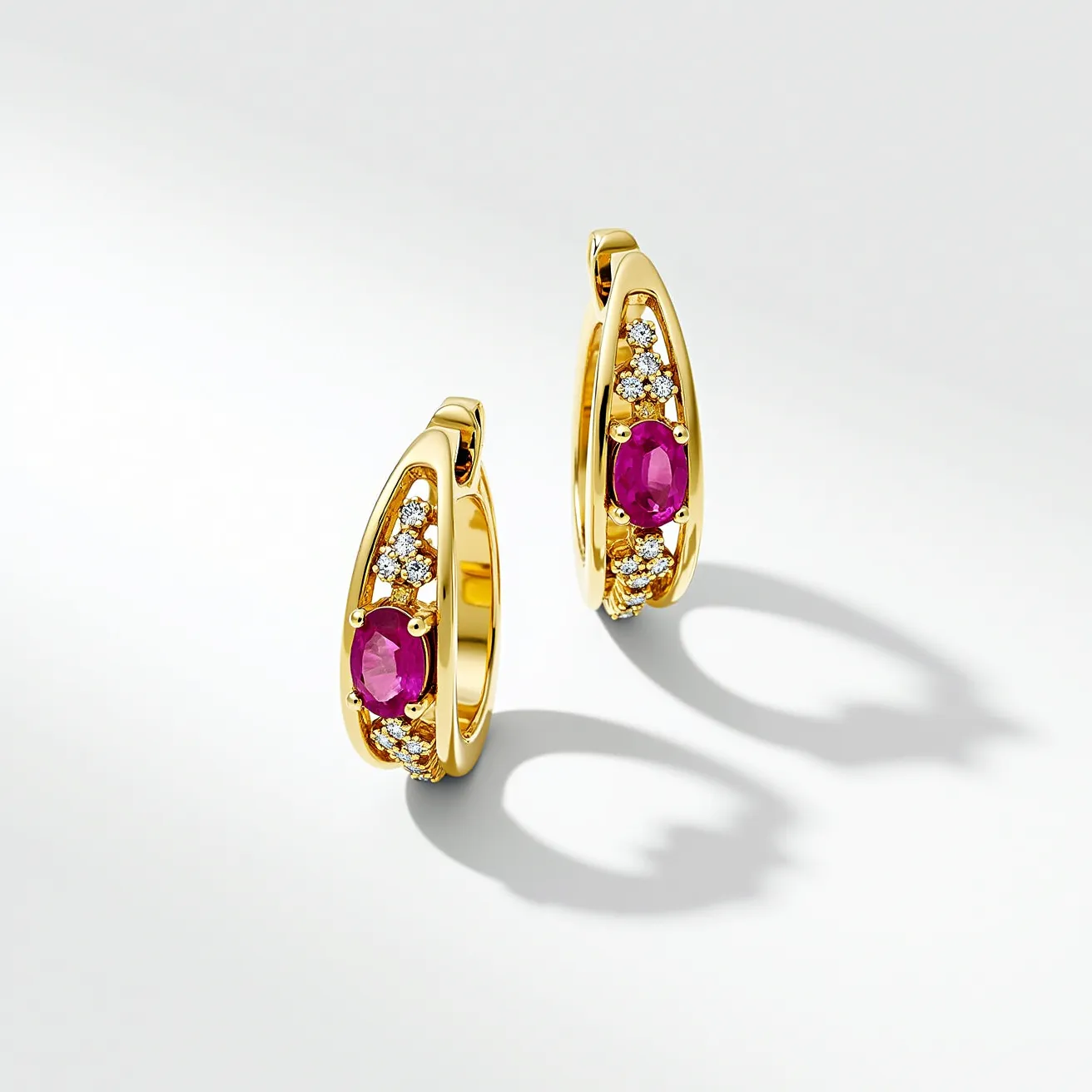 These huggie earrings feature a striking design crafted from polished gold, providing a luxurious base for the elegant adornments. The center of each earring prominently displays an oval-cut ruby, securely set with four prongs, exuding a deep, vivid red hue. Flanking the ruby on both sides are clusters of small, round brilliant-cut diamonds, each snugly held in a pave setting, adding a touch of sparkling brilliance and contrast to the centerpiece. The hoop style of these earrings allows for a seamless closure mechanism, ensuring they are both secure and comfortable for the wearer.