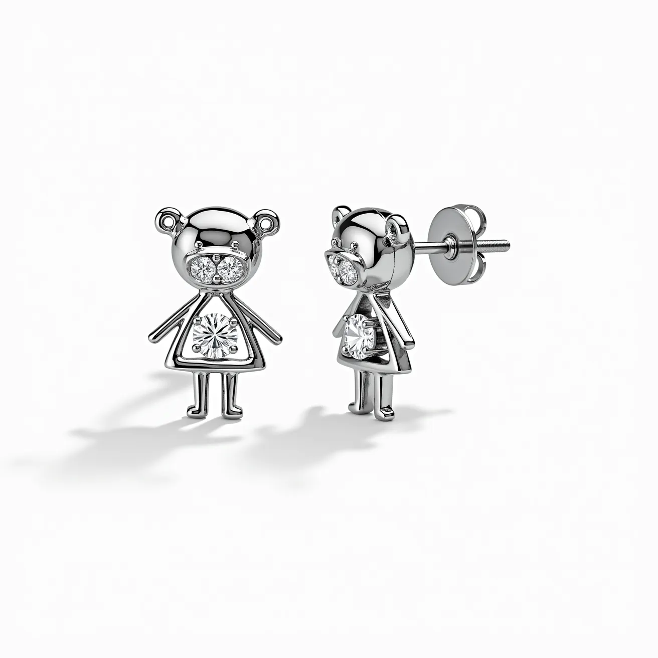 These little girl earrings feature a charming design that includes a figure crafted from metal, likely silver or white gold. The earrings are adorned with clear, round-cut gemstones positioned in the head and body of the figure, contributing a sparkling effect. The stones are securely set, possibly in a prong or bezel setting, ensuring they are both eye-catching and safe from loss. The earring attachment is a classic stud style with a butterfly or friction back clasp, providing a secure and comfortable fit for everyday wear. The whimsical design combines a playful form with elegant materials, making them suitable for a young wearer.