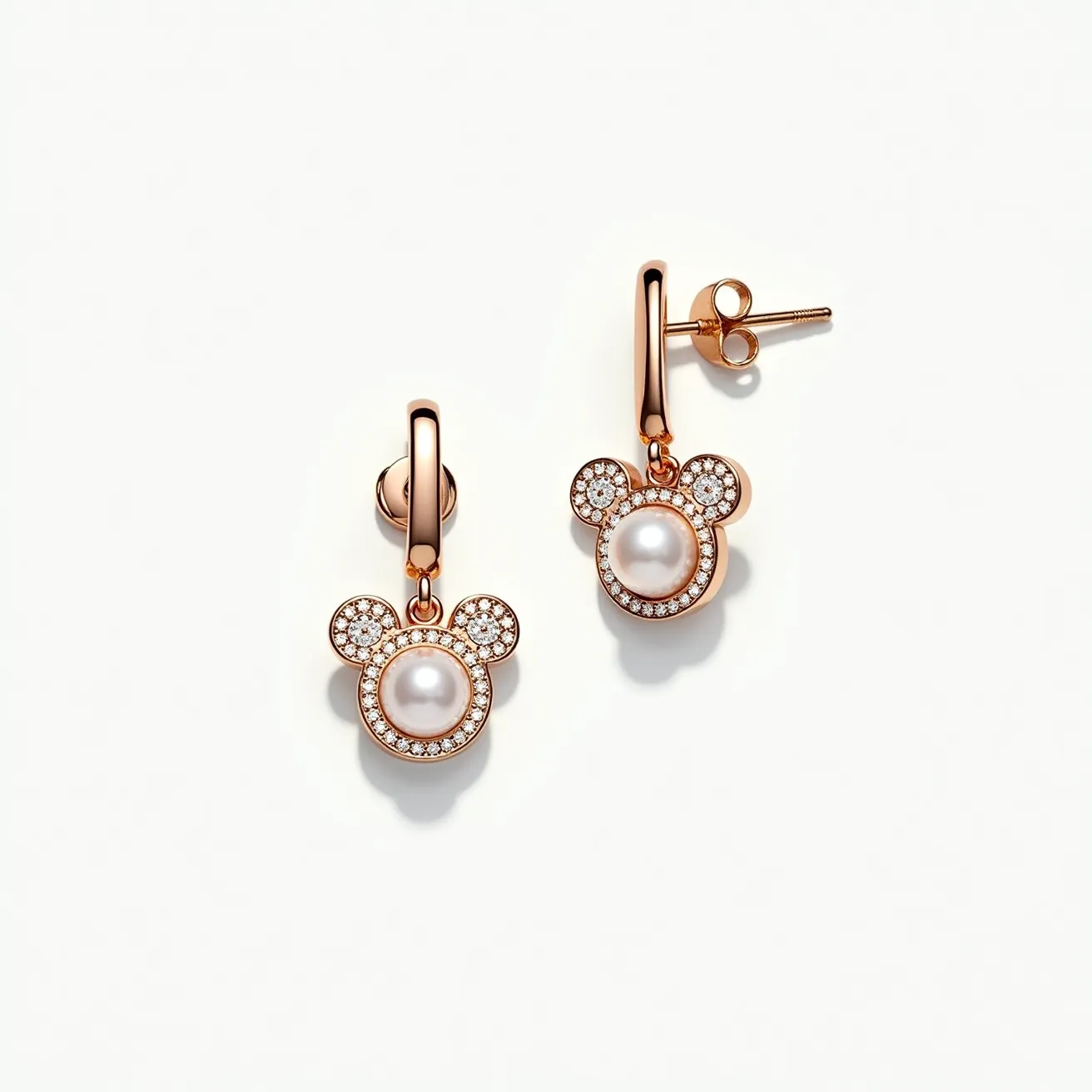 These Mickey Mouse earrings feature a charming design with a rose gold-tone metal forming the iconic silhouette of Mickey Mouse's head. At the center of each earring is a round pearl, set into the largest circular section, representing Mickey's face. The pearl is surrounded by small, round-cut clear stones encrusted in a halo setting, adding a touch of sparkle to the design. The two smaller circles, which represent the ears, are also bordered with the same small stones. The earrings include a simple hoop and post attachment, providing a secure and elegant clasp mechanism. The overall look is playful yet sophisticated, combining classic motifs with high-quality materials.