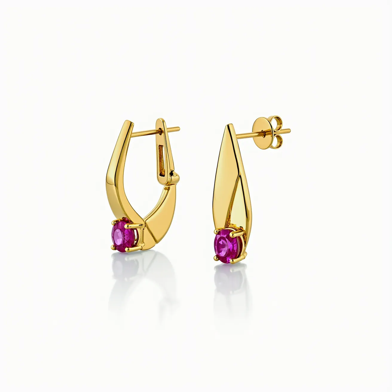 These pink sapphire earrings feature an elegantly modern design crafted from a gold material, showcasing a polished and refined finish. At the center of each earring is a vibrant pink sapphire, cut into a smooth, round shape, emphasizing its lustrous and rich color. The sapphires are securely held in place by a prong setting, which allows maximum light exposure and enhances the gemstone's sparkle. The earrings have an integrated push-back post for secure attachment, combining practicality with stylish appeal. The overall design highlights a contemporary aesthetic, ideal for adding a touch of sophistication to any ensemble.