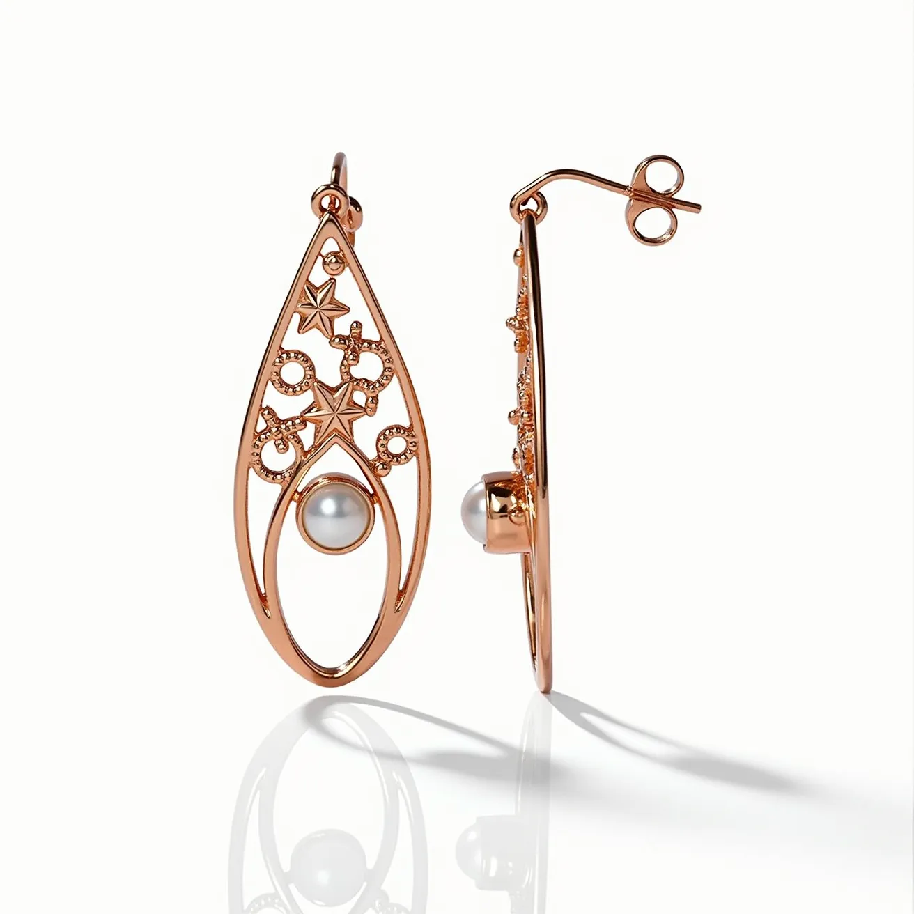 These rose gold earrings feature an openwork design with intricate star and swirl patterns that add a touch of elegance. Each earring is adorned with a single round pearl, positioned centrally at the base of the teardrop-shaped frame, enhancing its sophisticated look. The pearl is set securely and subtly within the rose gold structure, complementing the warm hue of the metal. The earrings are crafted with a simple post-back closure, ensuring ease of wear and a secure fit. Overall, the combination of rose gold and pearl creates a harmonious and stylish accessory.