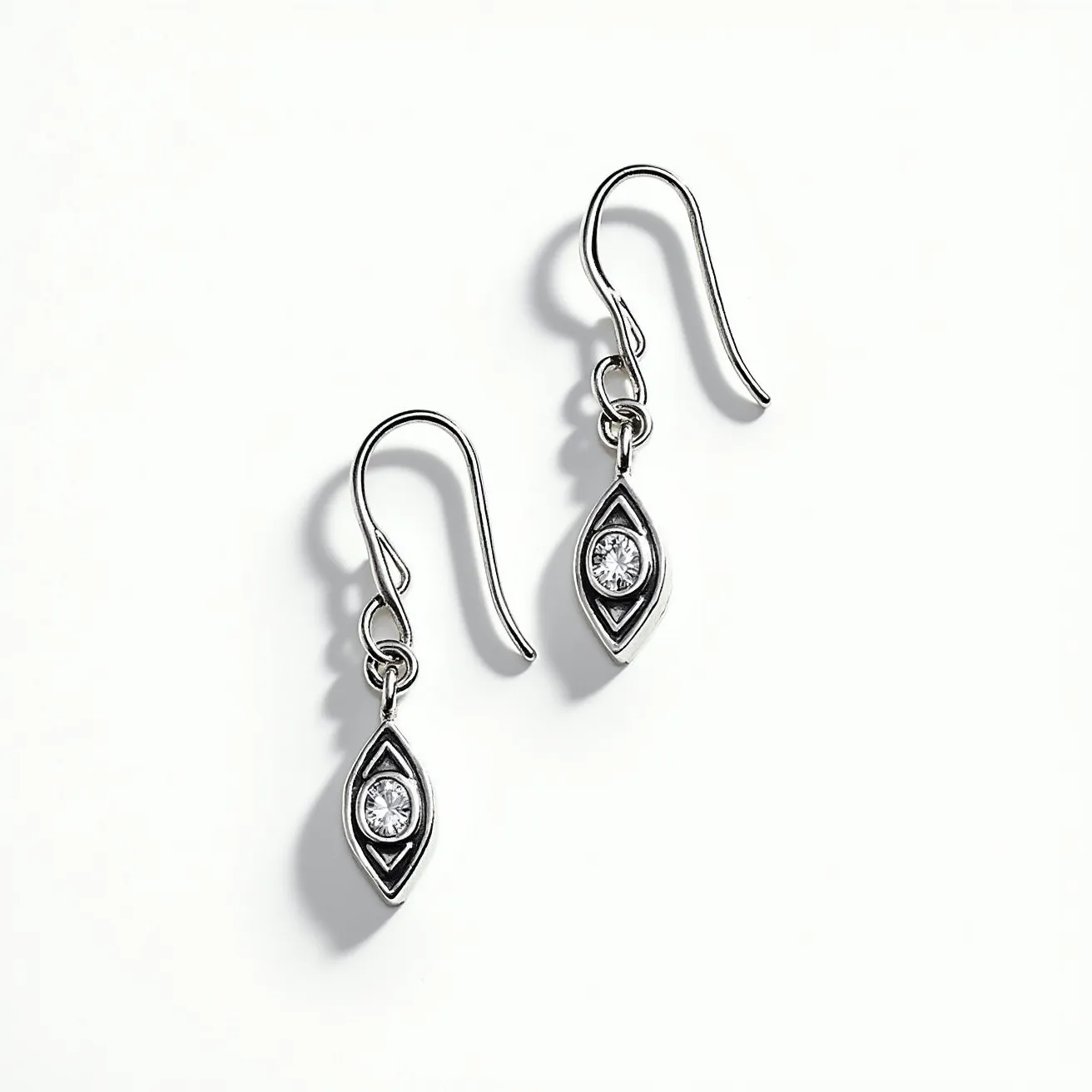 These silver dangle earrings feature a sleek marquise-shaped design crafted from polished silver. At the center of each earring is a single round-cut gemstone that appears to be set in a bezel setting, offering a secure and elegant display. The earrings are equipped with a simple fish hook clasp, providing ease of wear and a comfortable fit. The overall design highlights a modern and sophisticated aesthetic.