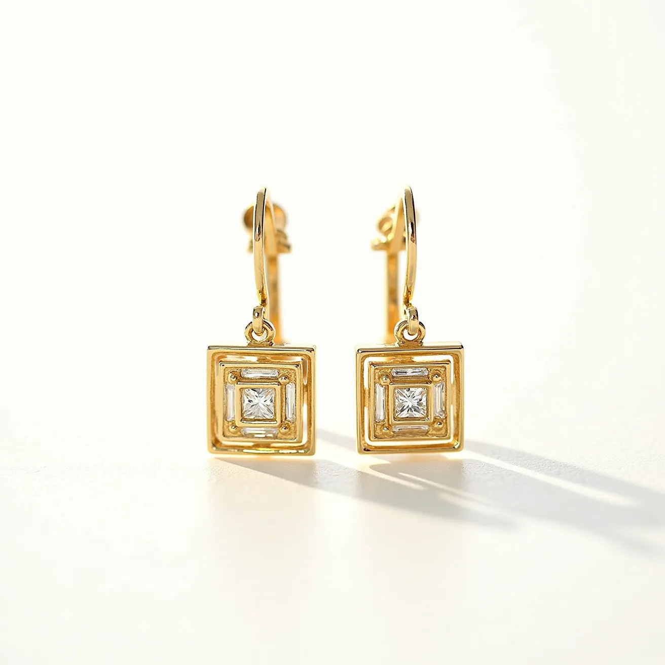 These square earrings feature a geometric design crafted from gold-colored metal, showcasing a modern and elegant appearance. At the center of each earring, there is a clear, square-cut gem, likely a diamond or a diamond simulant, securely set in a bezel, enhancing the sparkle and sophistication of the piece. The earrings are designed with a lever-back clasp, providing a secure and comfortable attachment. These elements combine to create an eye-catching and luxurious accessory suitable for various occasions.