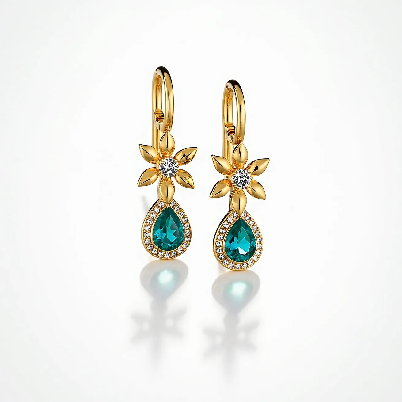 These teal earrings feature a striking design with a pear-shaped teal gemstone set prominently as the centerpiece. The gemstone is surrounded by a halo of small, glittering clear stones, enhancing its brilliance and elegance. Above the gemstone, a floral motif is crafted with gold-toned petals surrounding a sparkling central stone, adding a touch of sophistication. The earrings are attached with a secure hoop clasp, ensuring they hang gracefully. Made with a combination of gold-toned metal and vibrant stones, these earrings offer a luxurious and eye-catching accessory piece.