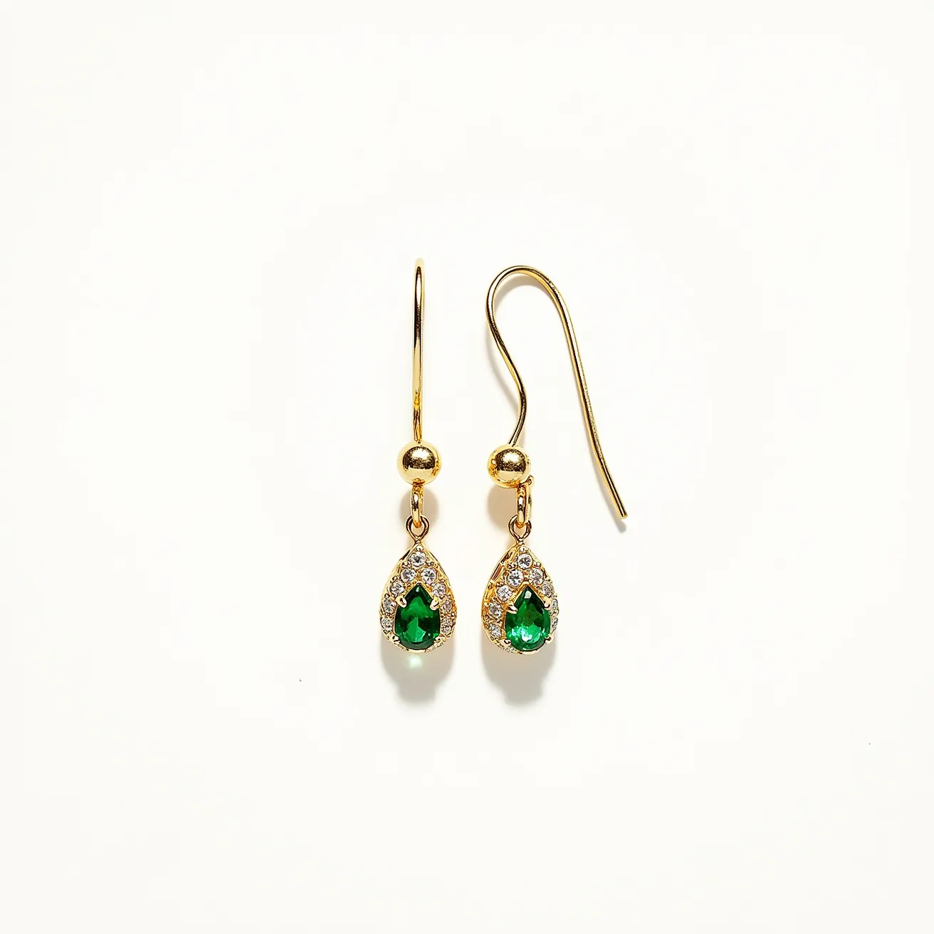 These teardrop earrings feature a striking emerald green gemstone at the center, cut in a teardrop shape, and surrounded by a halo of smaller, clear stones that add a touch of sparkle. The stones are set into a gold-toned metal, giving the earrings a classic and elegant look. The earrings are designed with a fishhook clasp, which provides a secure yet graceful attachment. The combination of the central green stone and the surrounding clear stones creates a timeless piece suitable for various occasions.