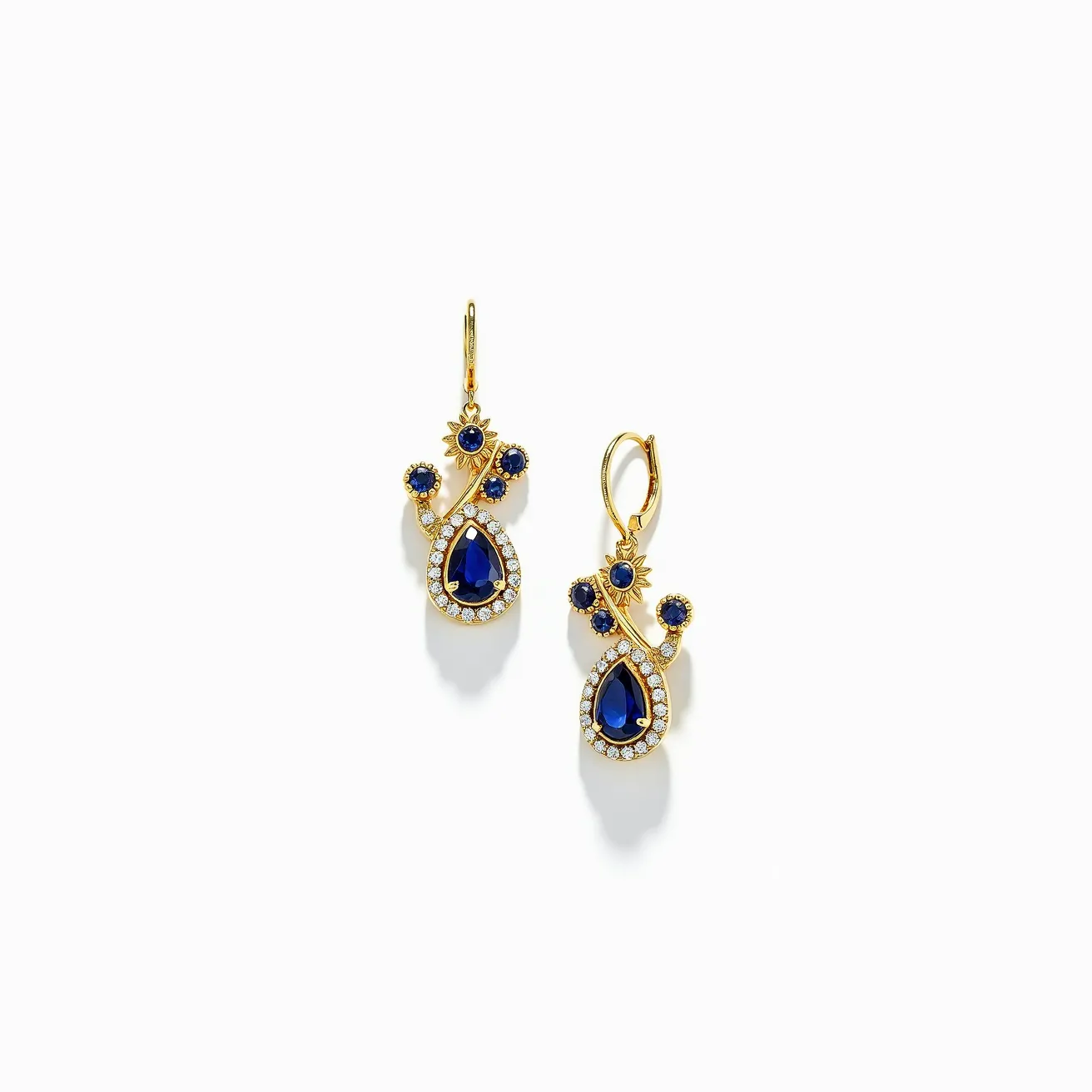 These teardrop earrings feature a stunning design with a prominent blue teardrop-shaped gem at the center, likely sapphire, surrounded by a halo of small, round-cut diamonds. The earrings are crafted from a gold material, which elegantly complements the deep blue of the central stones. Additional round blue stones, also likely sapphires, are interspersed along the gold structure, adding to the elegance and complexity of the design. The gems are securely set in a prong or bezel setting, enhancing their visibility and brilliance. The earrings have a lever-back clasp, providing a secure and comfortable fit for the wearer.