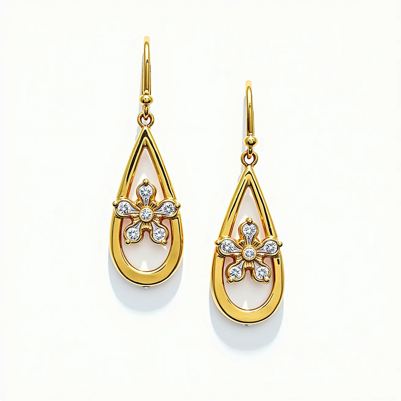 These teardrop earrings feature a delicate open-frame design crafted from gold-tone metal. Each earring showcases a charming floral motif at the center, adorned with small round clear stones that resemble diamonds, securely set in place. The petals are intricately detailed, adding an elegant touch to the overall design. The earrings are equipped with hook clasps that elegantly secure them to the ear, providing both style and comfort.