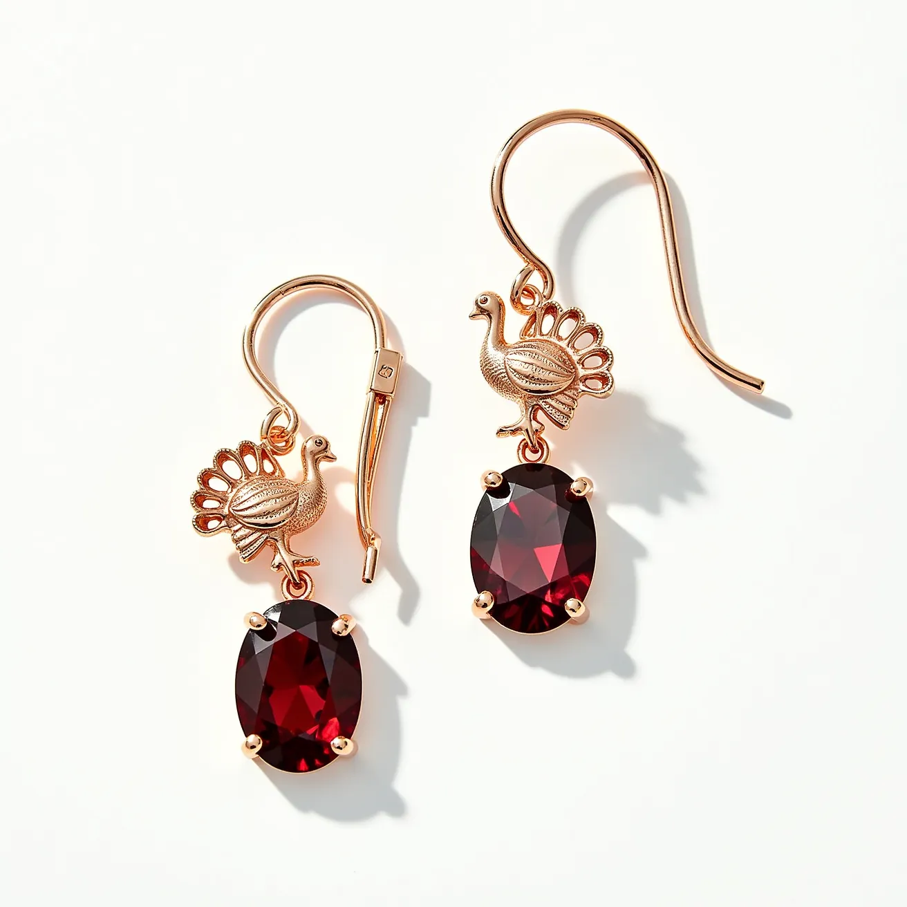 These Thanksgiving earrings feature a charming design with gold-tone turkey motifs at the top, adding a festive touch. The earrings showcase oval-cut deep red stones, securely held in a classic four-prong setting that enhances their rich hue. The fishhook clasp ensures ease of wear and complements the overall elegant aesthetic. These earrings bring together playful and sophisticated elements, making them perfect for the holiday season.