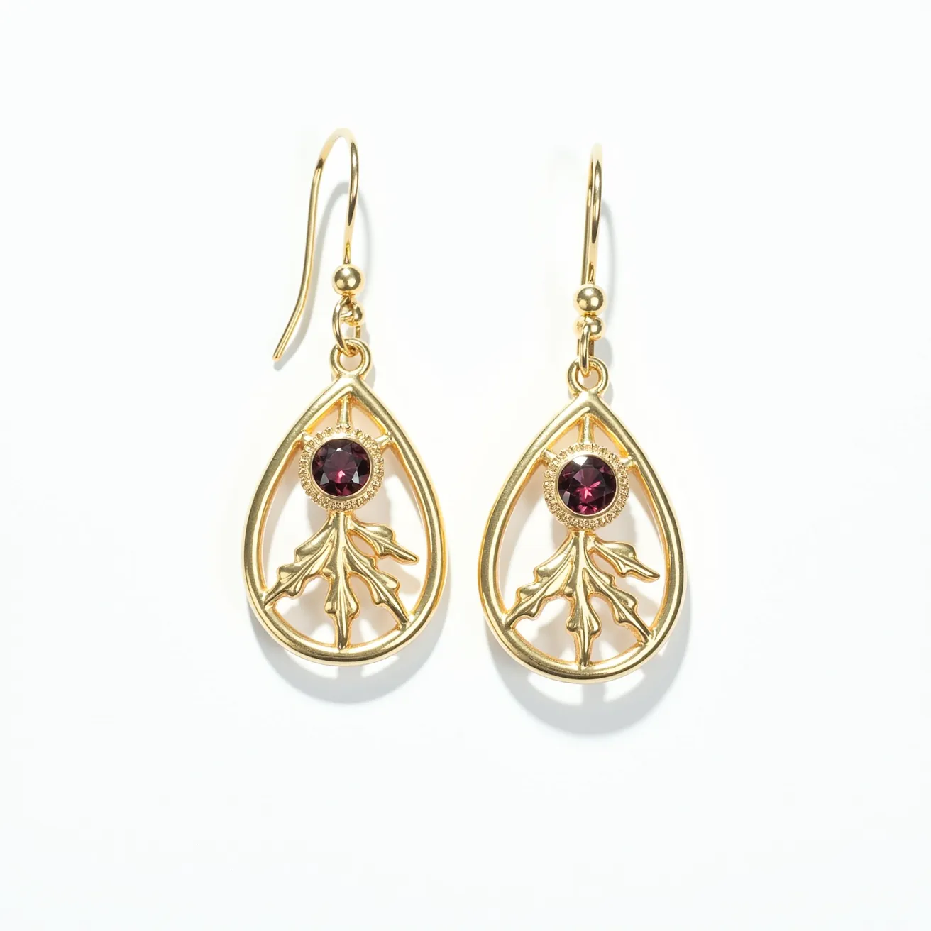 These Thanksgiving earrings feature an elegant design comprised of teardrop-shaped gold-plated frames with intricate leaf motifs delicately crafted within. At the center of each teardrop is a round-cut, deep red stone, securely set in a bezel setting that accentuates its color and sparkle. These earrings are designed with a fishhook clasp, allowing them to dangle gracefully when worn. The combination of the rich gold tones and the vivid red stones captures the essence of autumn, making them an ideal accessory for the Thanksgiving season.