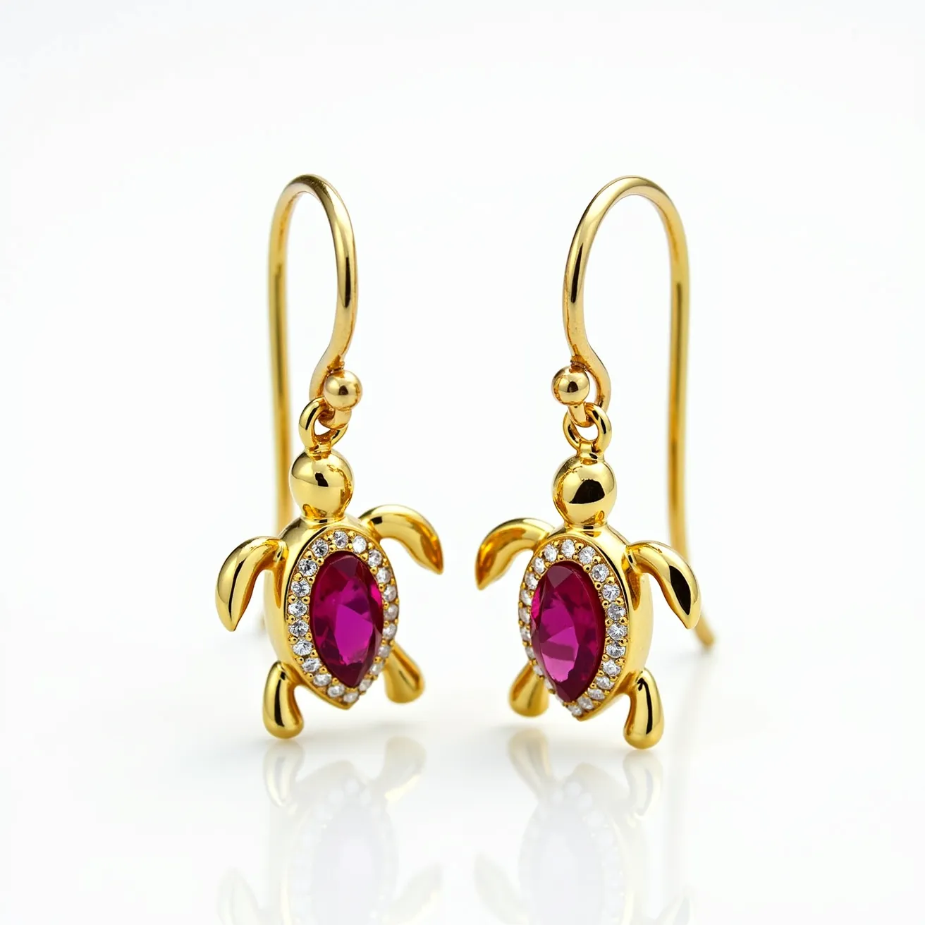 These turtle earrings are designed with a gold-toned material that forms the body and limbs of the turtle. Each earring features a marquise-cut pink gemstone, which serves as the turtle's shell, surrounded by a border of small clear stones, likely cubic zirconia or diamonds, set in a pavé style. The earrings are suspended from a simple hook clasp, which allows for easy wearing and movement. The combination of the vibrant pink gemstone and the sparkling clear stones provides an elegant contrast to the shiny gold-tone setting.