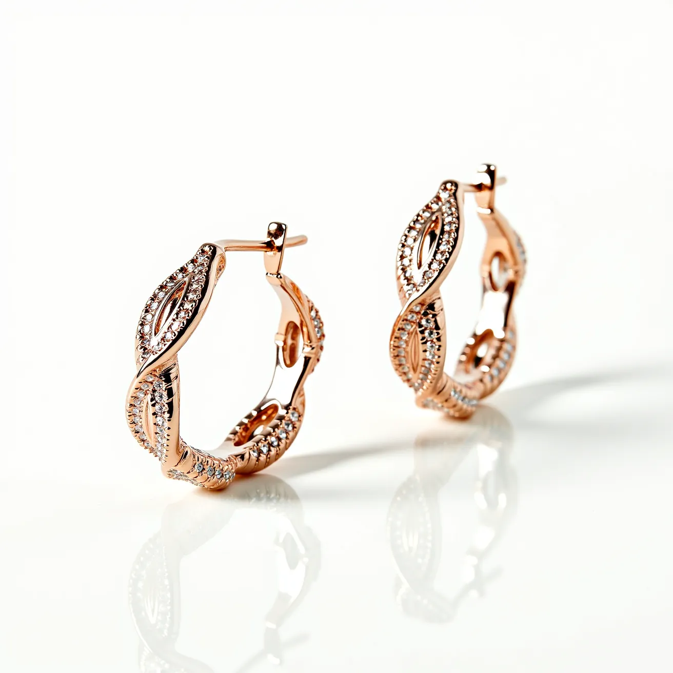 These twisted hoop earrings are elegantly crafted from a rose gold-toned metal, featuring an intricate design that intertwines gracefully around the hoop. The surface of the earrings is adorned with small, round-cut stones, likely diamonds or diamond simulants, set in a pave setting which enhances their brilliance and adds a touch of sparkle. The earrings are designed with a latch back clasp, providing a secure closure while maintaining ease of wear. The combination of twisted metalwork and sparkling stones gives these earrings a sophisticated and luxurious appearance, making them a striking accessory for any occasion.