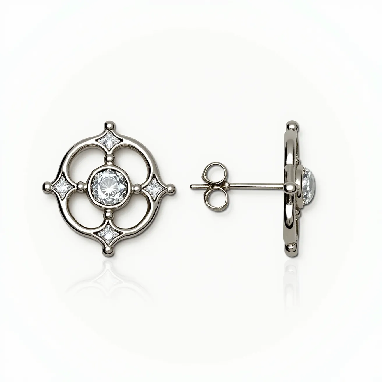 These white earrings feature a central round-cut gemstone, likely a diamond, set within an elegant circular metal framework that appears to be made of polished white gold or platinum. The centerpiece is surrounded by four smaller, square-cut gems, each positioned at the north, south, east, and west points, adding a symmetrical and balanced design. The stones are bezel-set, ensuring a secure hold while maximizing their brilliance. These earrings use a post and butterfly back closure system, providing both ease of wear and reliable fastening. The overall design integrates both classic and contemporary elements, making it suitable for various occasions.