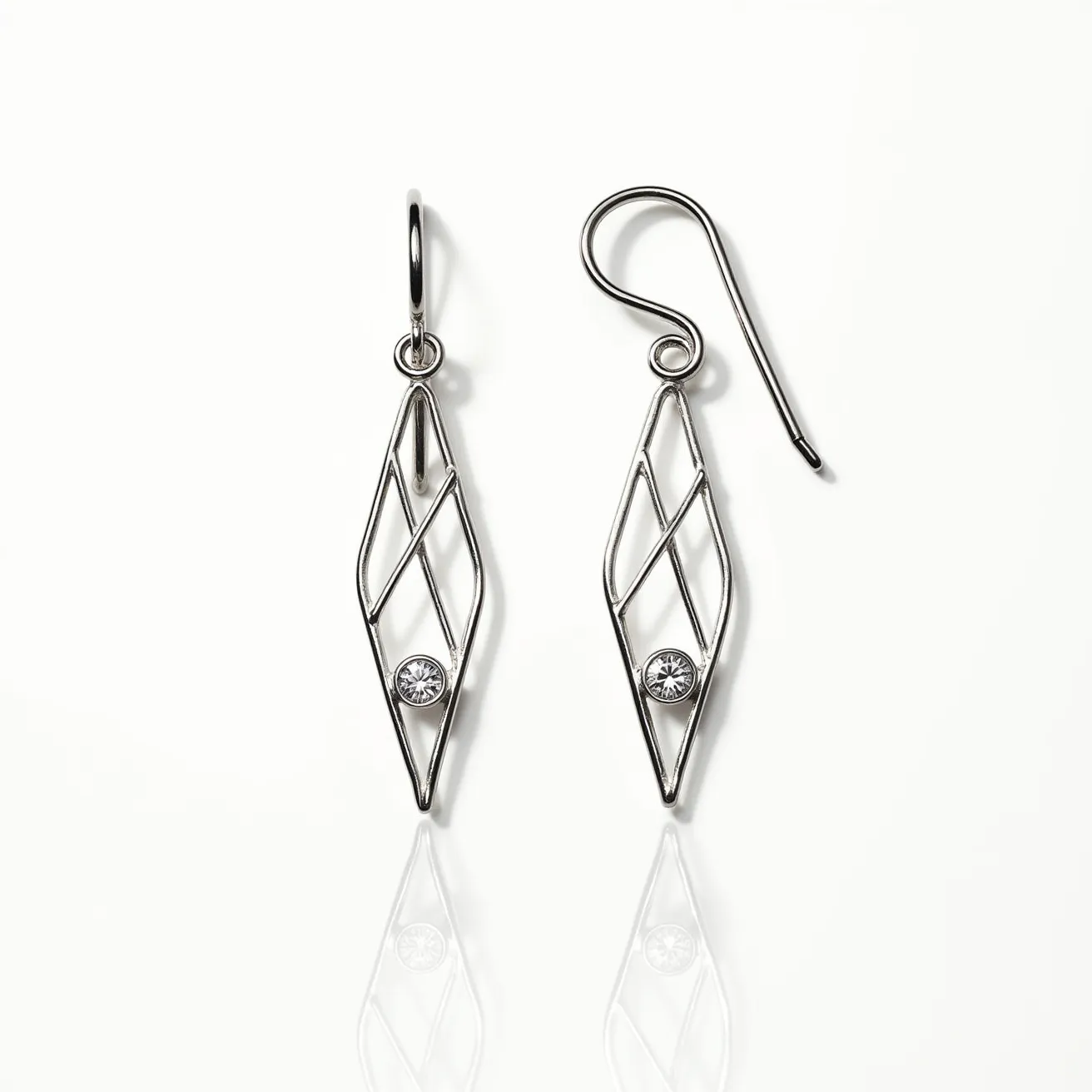 These wire earrings feature a delicate geometric design formed with slender metal wires, likely crafted from silver or a similar polished metal. Each earring is ornamented with a single round gemstone, set in a bezel setting that securely holds the stone in place while adding a touch of elegance. The earrings are designed with a simple hook clasp, making them easy to wear and ensuring they stay securely fastened to the earlobe. The overall style is modern and sophisticated, suitable for both casual and formal occasions.