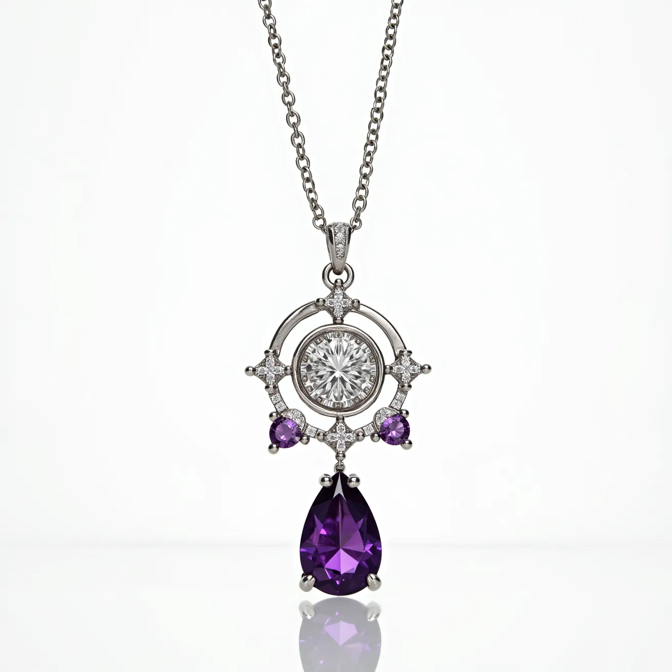 This alexandrite necklace features a beautifully designed pendant that showcases a large pear-shaped purple gemstone, presumably alexandrite, set prominently at the bottom of the piece. Above it, two smaller round purple gemstones are symmetrically placed on either side, further enhancing the design. At the center of the pendant is a sizable round diamond or diamond-like gem, surrounded by a circular frame adorned with additional smaller, sparkling diamond accents. These smaller stones appear to be prong-set, adding an intricate touch to the overall aesthetic. The pendant hangs from a delicate chain, likely made of white gold or platinum, which complements the shimmering stones and sophisticated design.