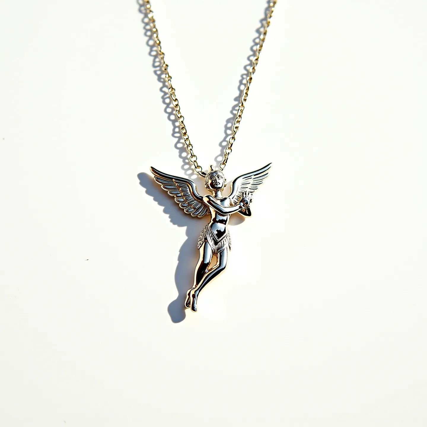 This angel necklace features a detailed charm depicting an angel with outstretched wings, crafted from a shiny metallic material that gives it a polished appearance. The pendant, likely made of silver or a silver-toned metal, portrays the angel in a graceful pose, which adds elegance to the piece. There are no visible gemstones or additional embellishments on the charm itself, allowing the intricate metalwork to stand out. The pendant is attached to a delicate chain, possibly made of a similar metal, creating a cohesive look. The chain appears to be secured with a standard clasp, ensuring ease of wear while maintaining the necklace's overall aesthetic appeal.